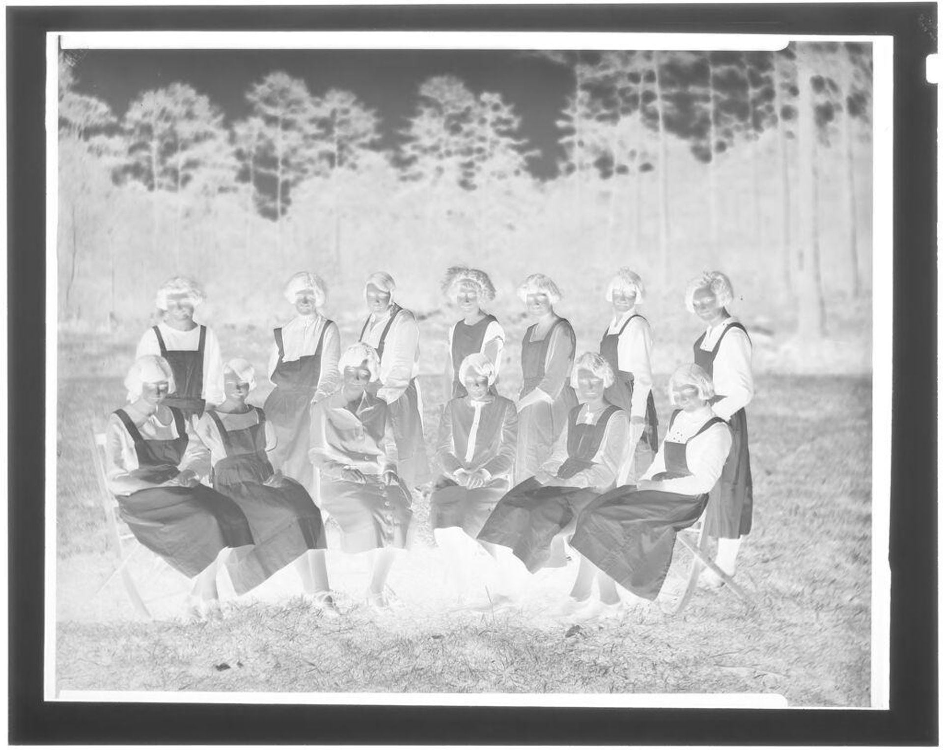 Untitled (group of aproned girls in field) by Hamblin Studio
