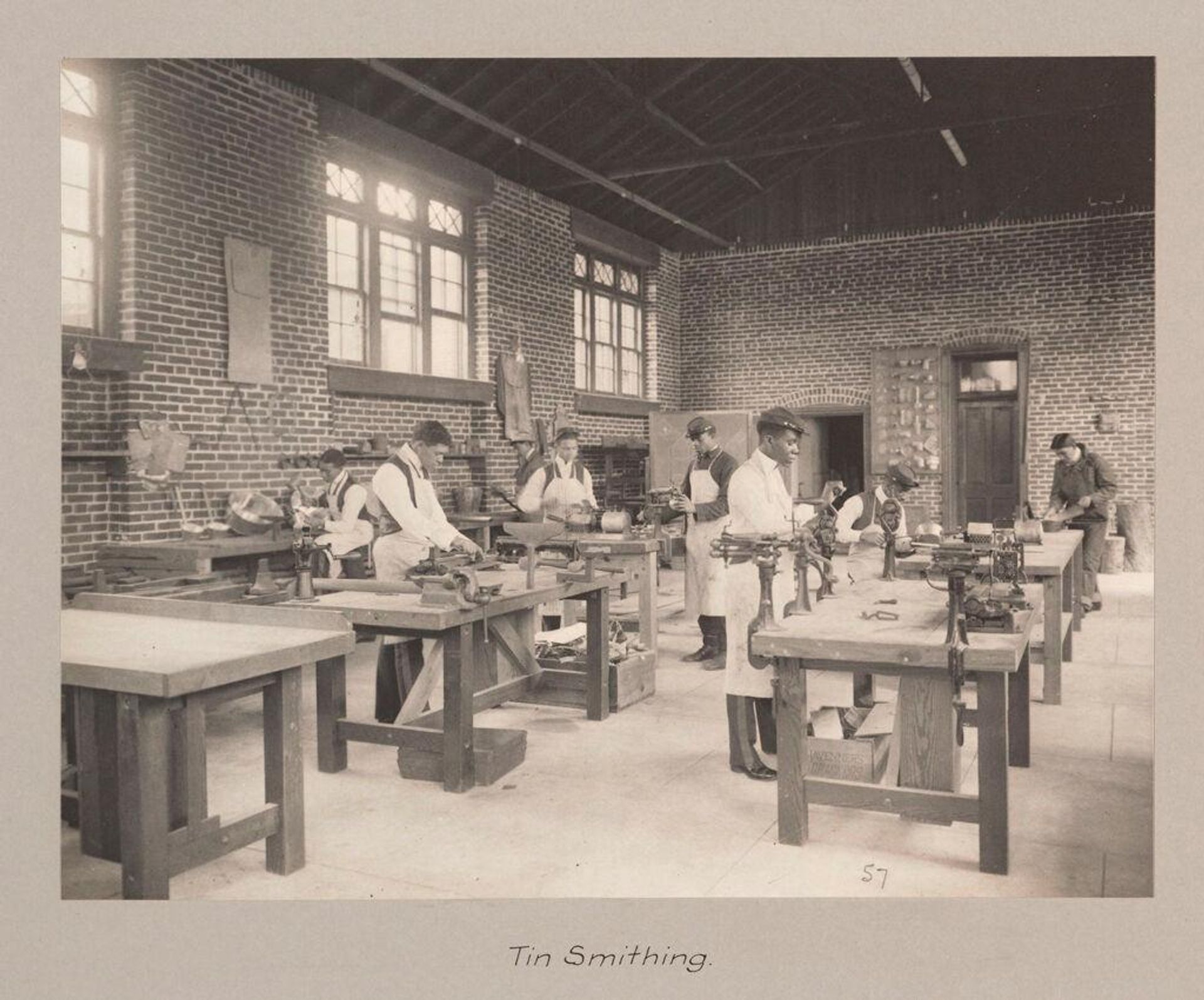 Races, Negroes: United States. Virginia. Hampton. Hampton Normal and Industrial School: Agencies Promoting Assimilation of the Negro. Training for Commercial and Industrial Employment. Hampton Normal and Agricultural Institute, Hampton, Va.: Tin Smithing. by Frances Benjamin Johnston