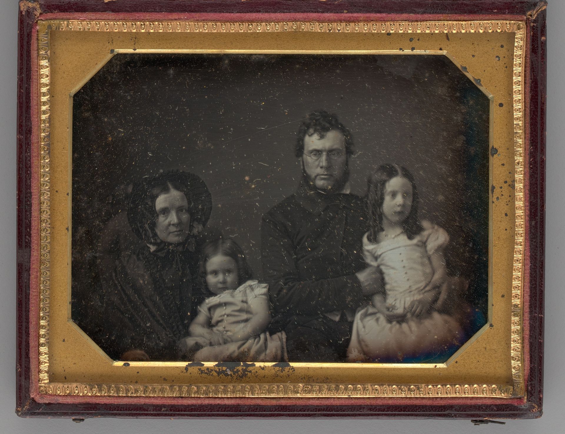 Untitled (Portrait of a Man, Woman and Two Girls) by Anonymous
