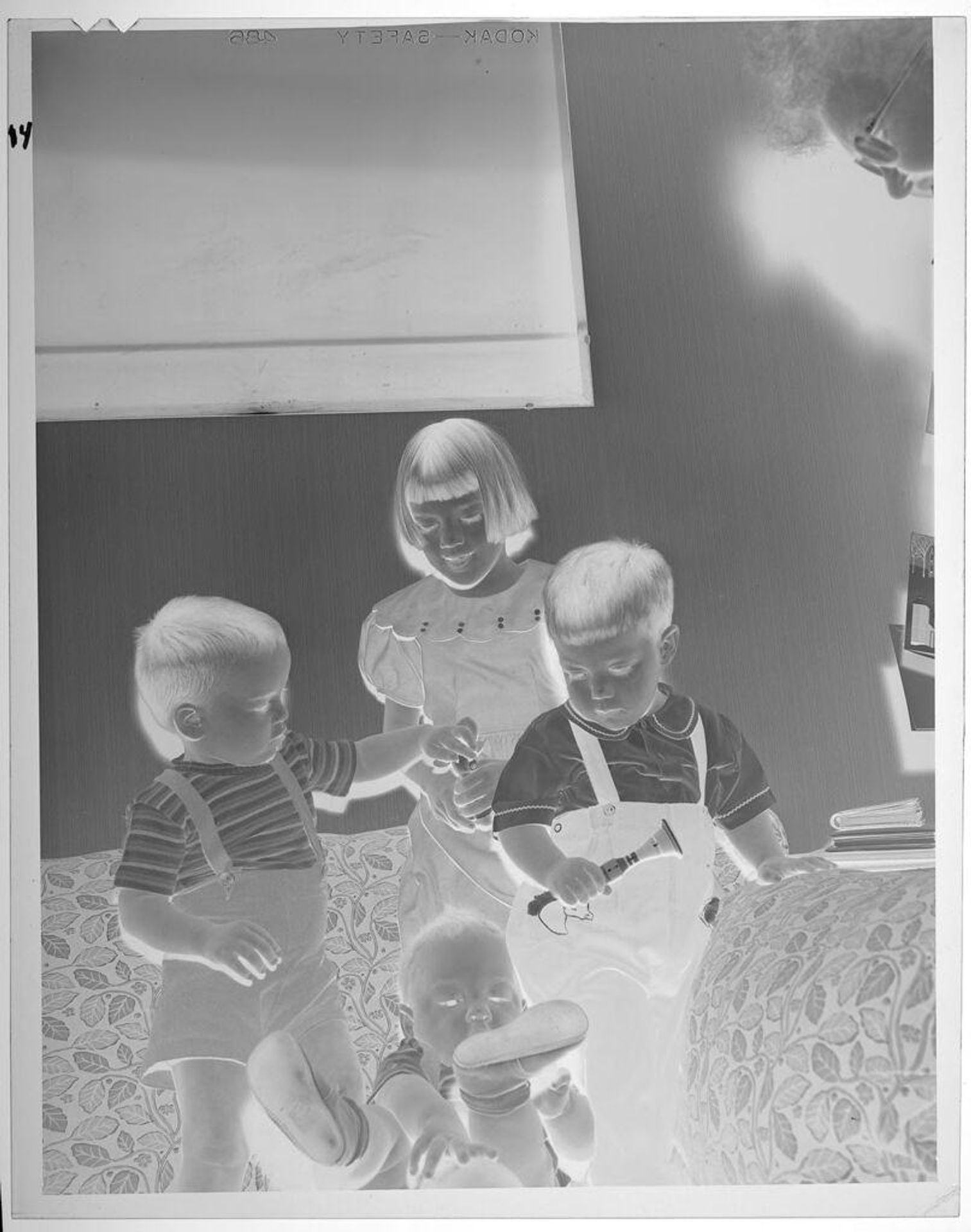 Untitled (girl and boys on couch) by Lucian and Mary Brown