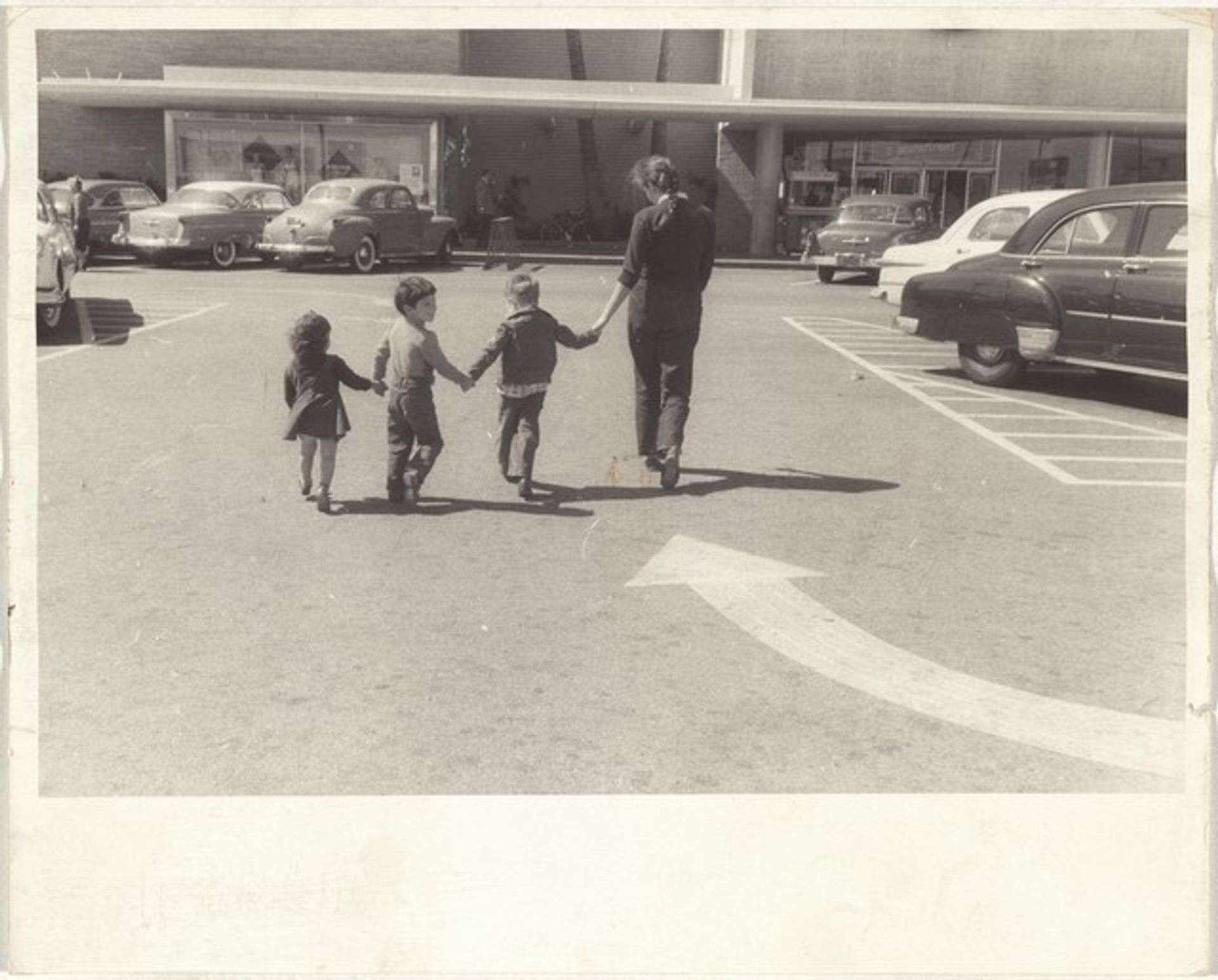 Mary, Pablo, Andrea, and boy in parking lot--Los Angeles by Robert Frank