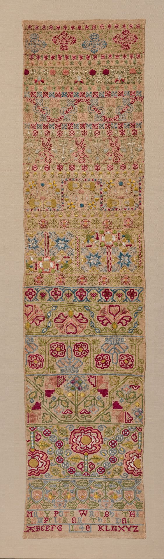 Embroidered band sampler by Mary Pots