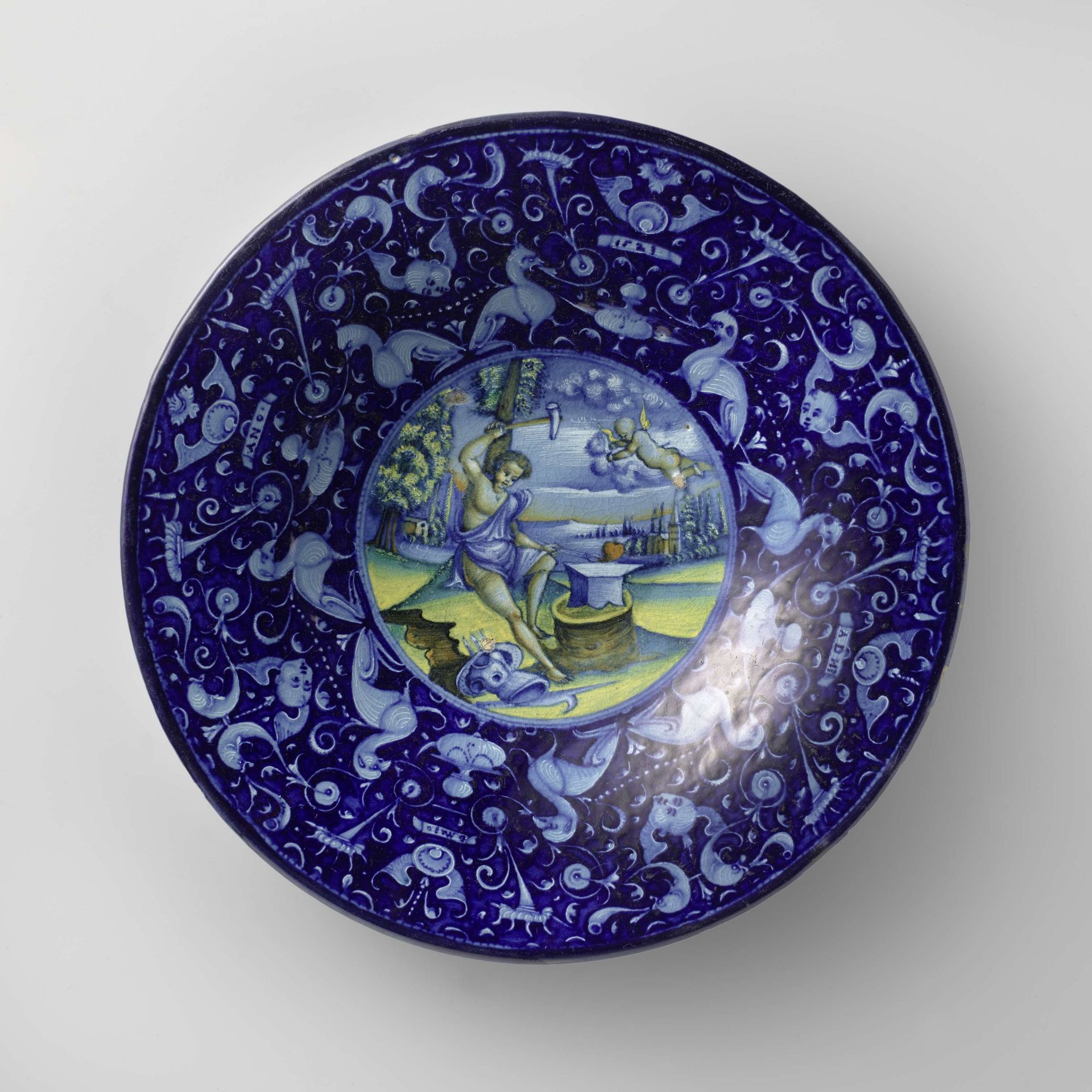 Plate with a blacksmith and a cupid in a landscape by Piero Bergantini