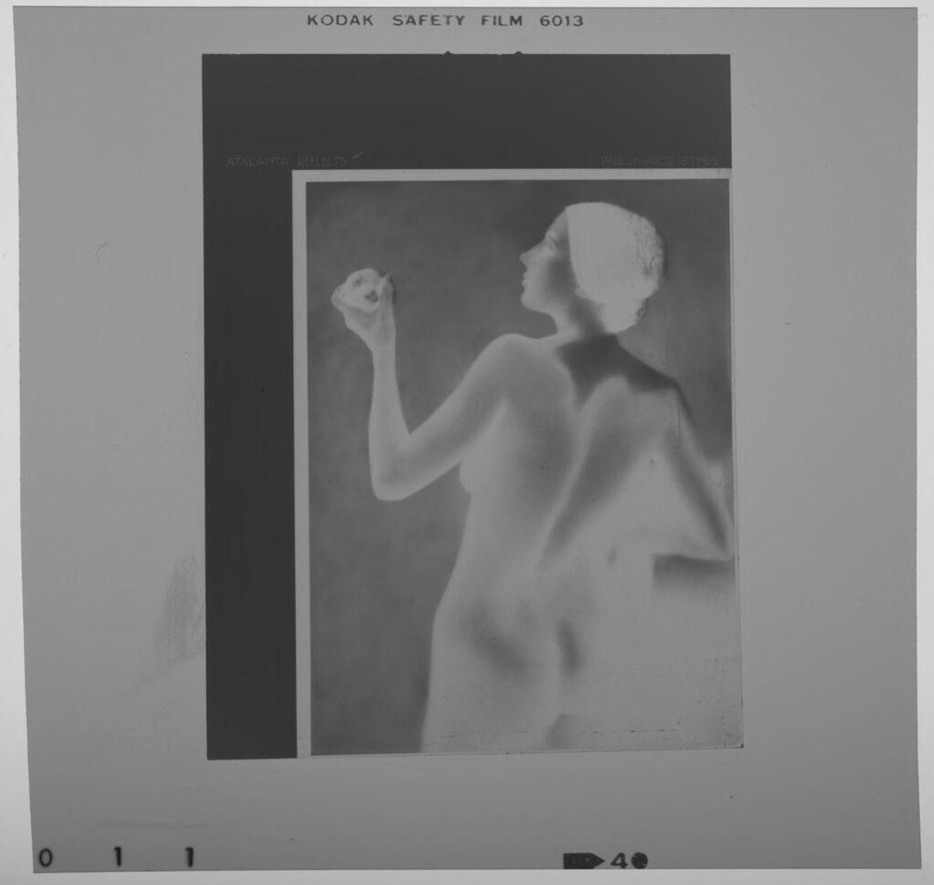 Untitled (photograph of "Atalanta Reflects": nude woman seen from back gazing at apple) by Paul Gittings