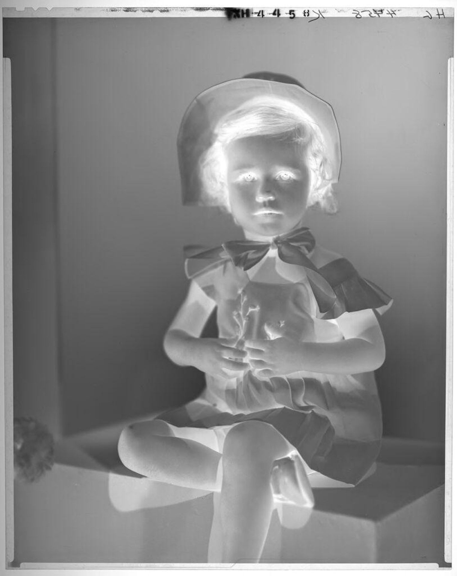 Untitled (portrait of little girl in dress with flower motif and bonnet) by Paul Gittings