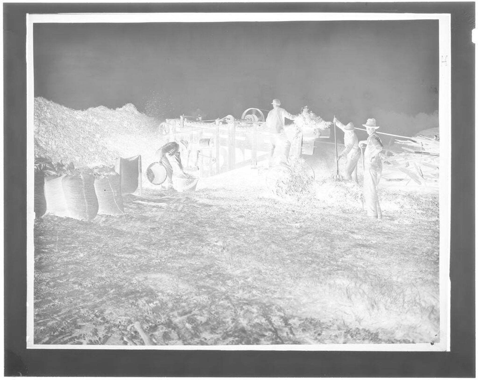Untitled (farm machinery in field) by Hamblin Studio