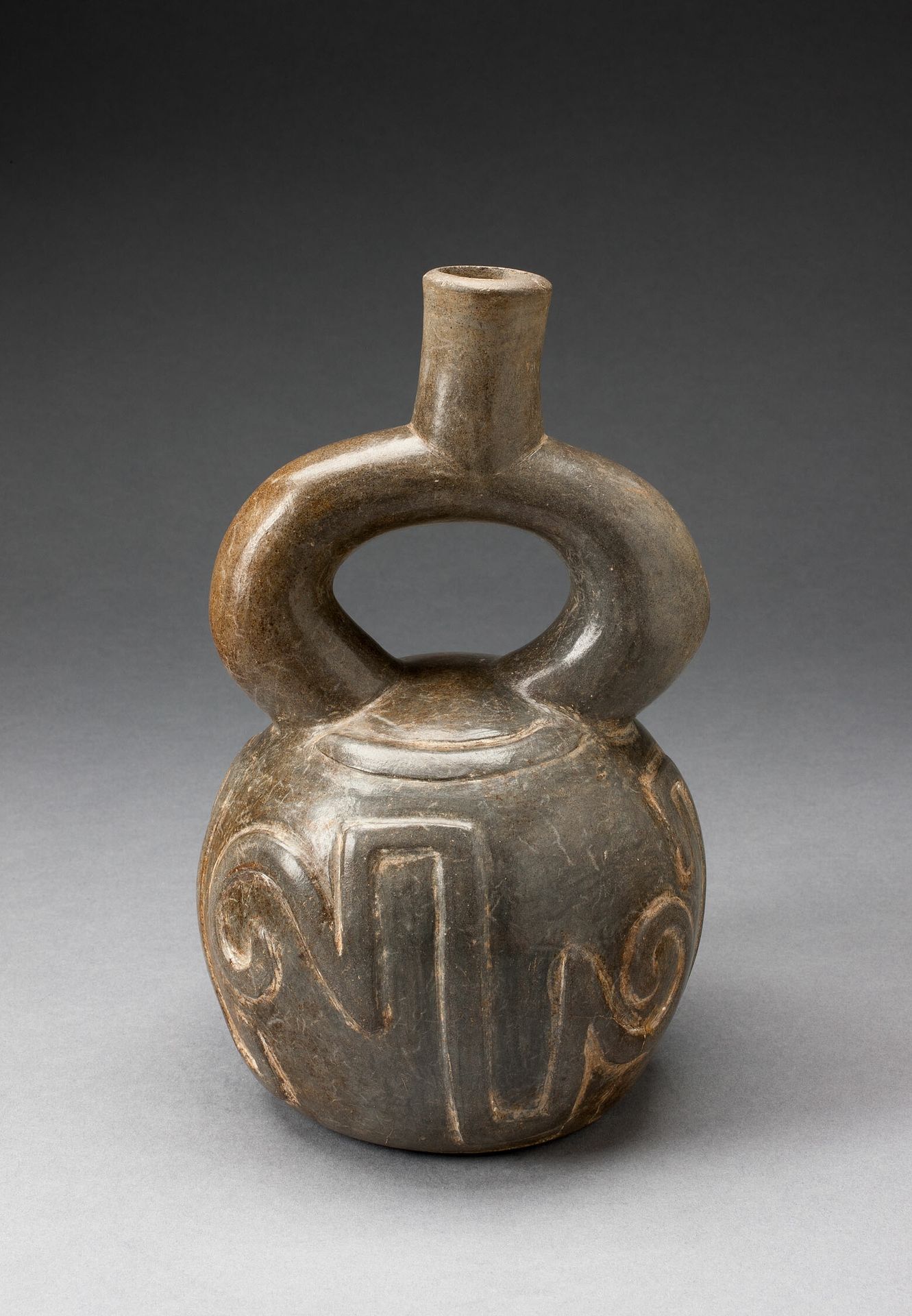Stirrup Spout Vessel with Raised Geometric Scroll Motif by Chavín