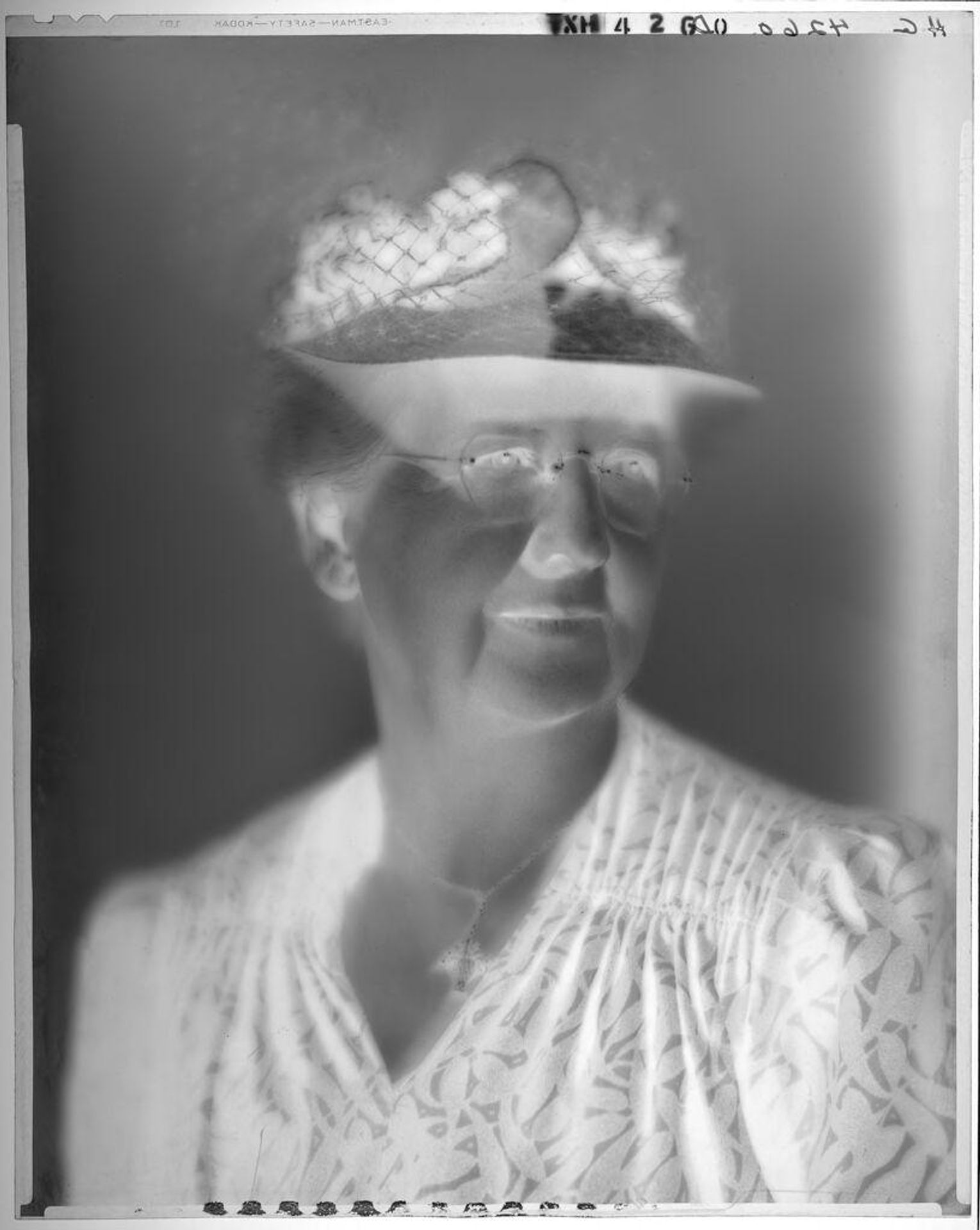 Untitled (portrait of an older woman wearing glasses and hat) by Paul Gittings