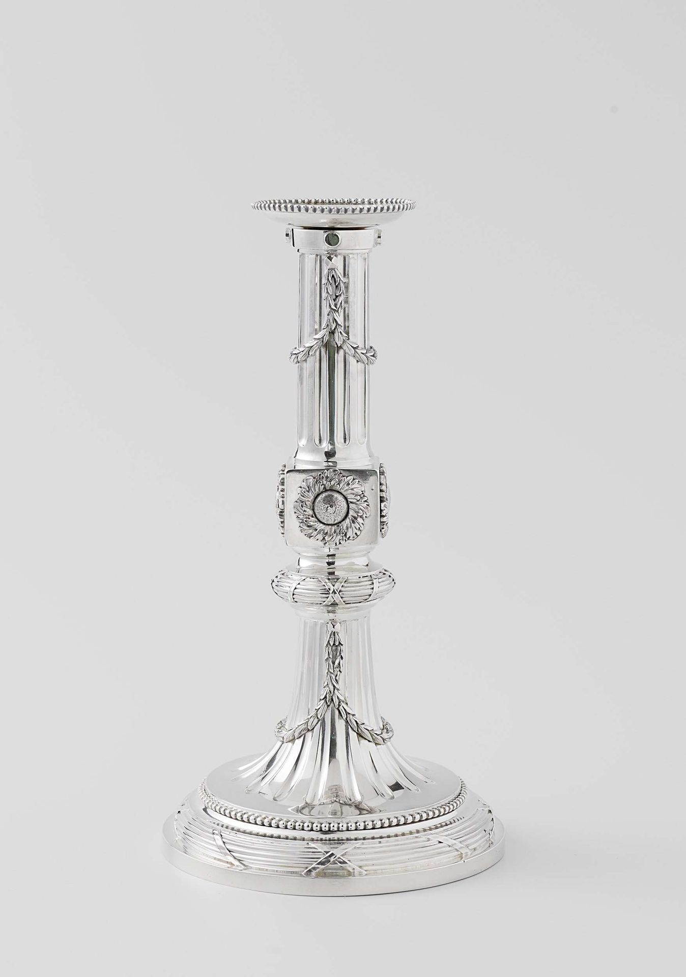 Four candlesticks by Cornelis Hendrik Bömcke