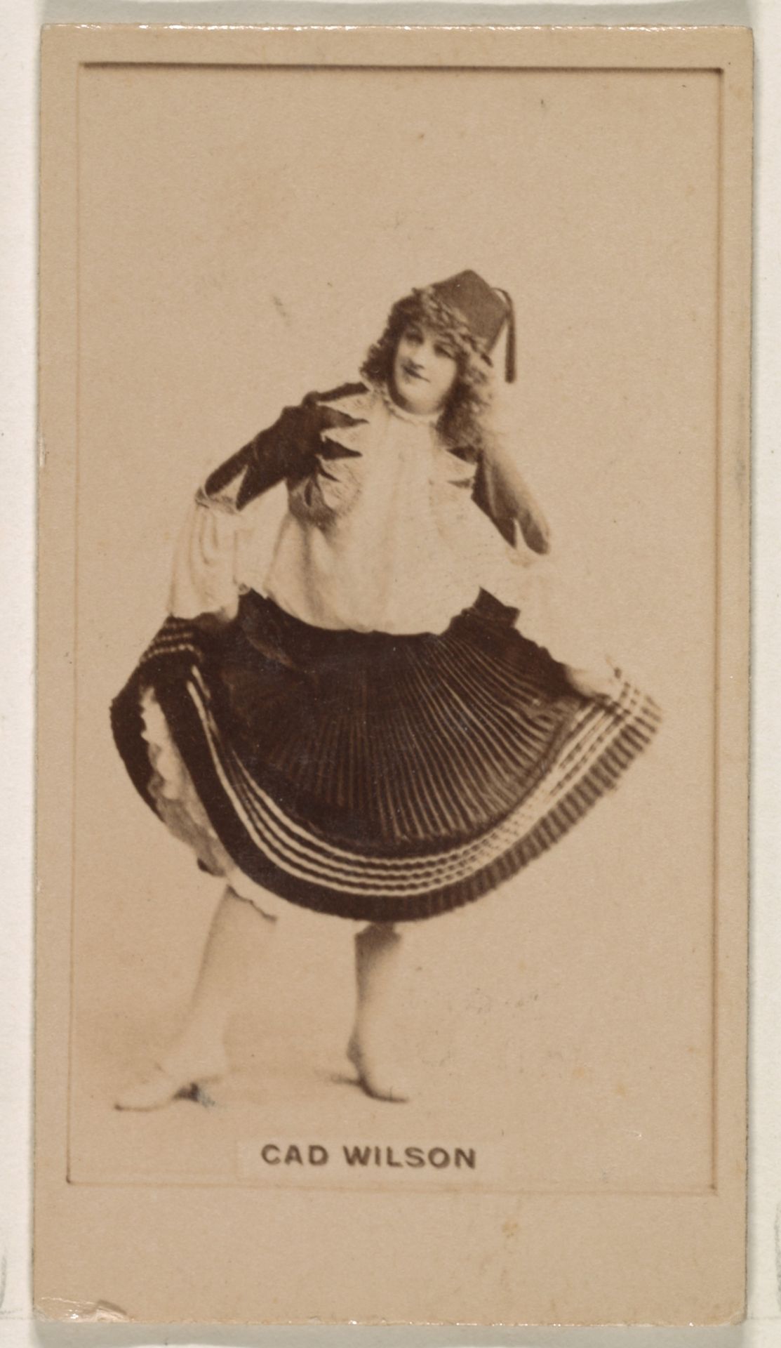 Cad Wilson, from the Actresses series (N245) issued by Kinney Brothers to promote Sweet Caporal Cigarettes by Kinney Brothers Tobacco Company