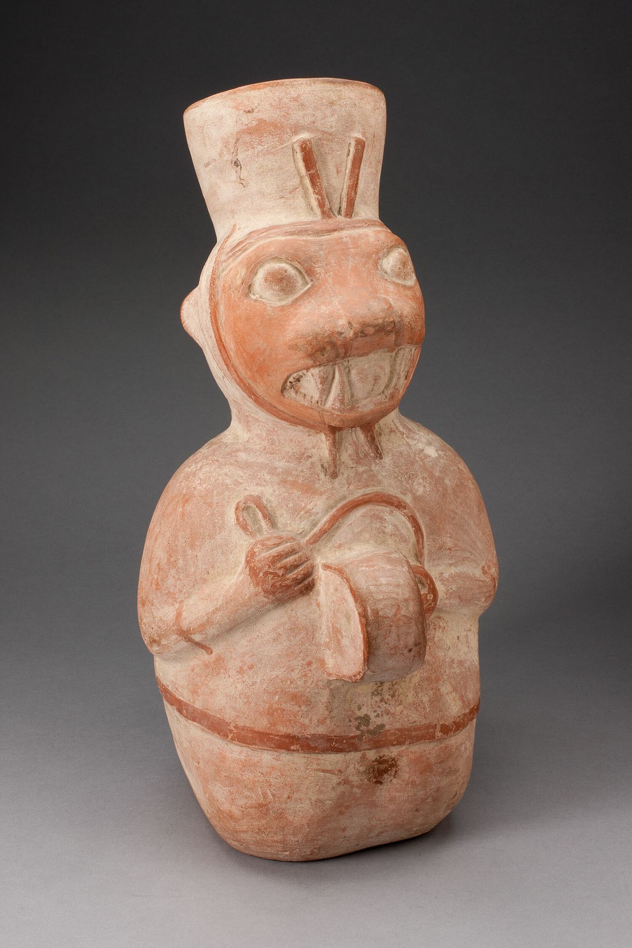 Jar in the Form of an Anthropomorphic Seal Playing a Drum by Moche