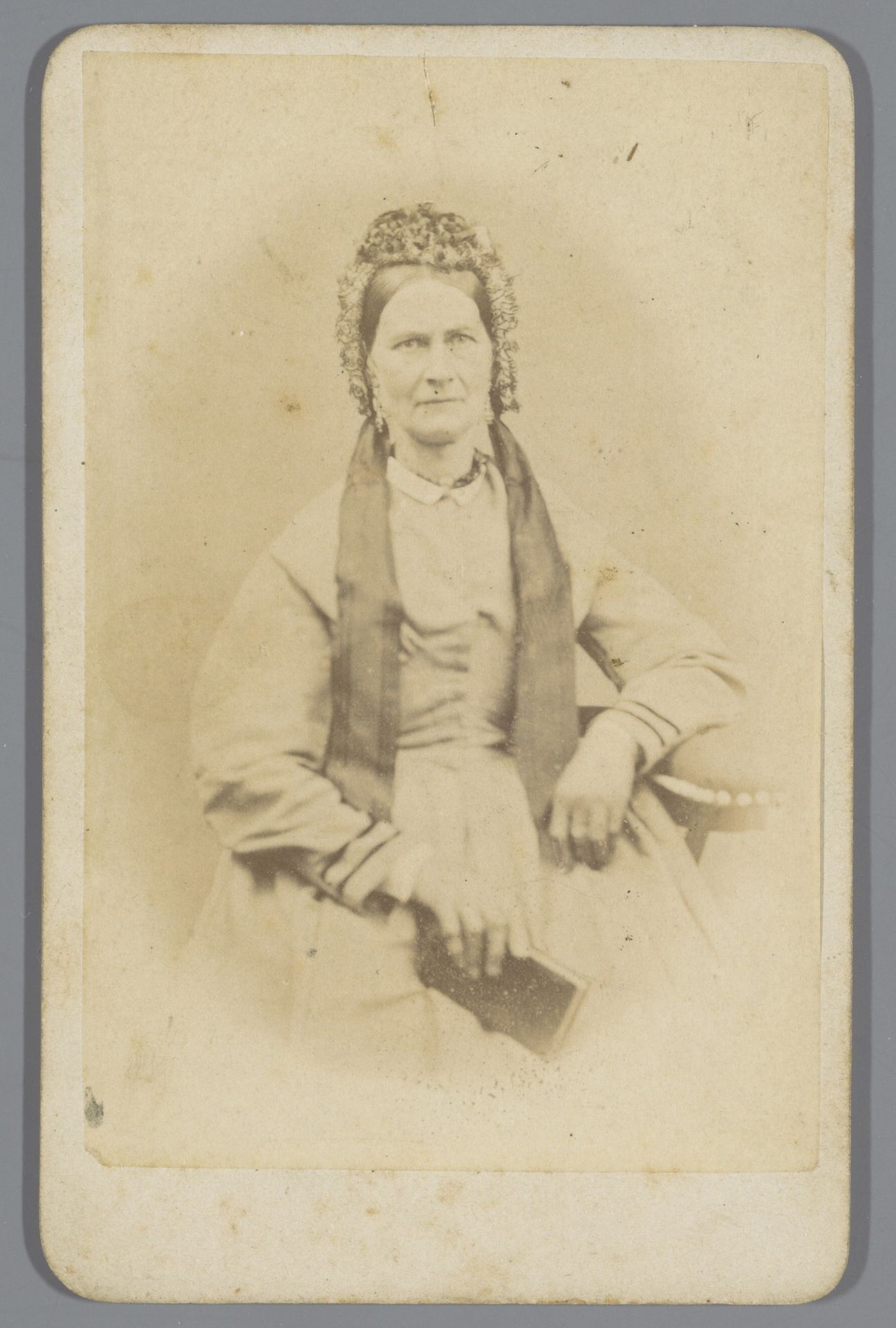 Portret van een onbekende vrouw met een boek by Coenraad Cornelis Roskam