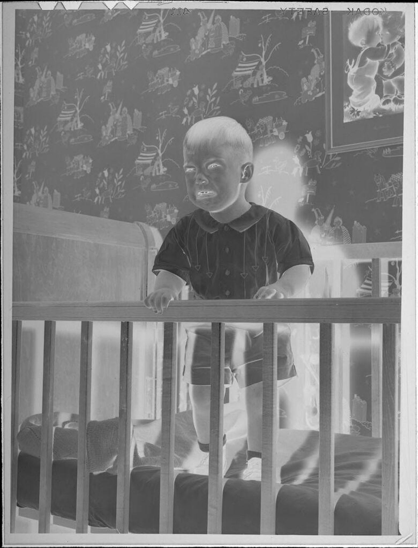 Untitled (baby standing in crib and crying) by Lucian and Mary Brown