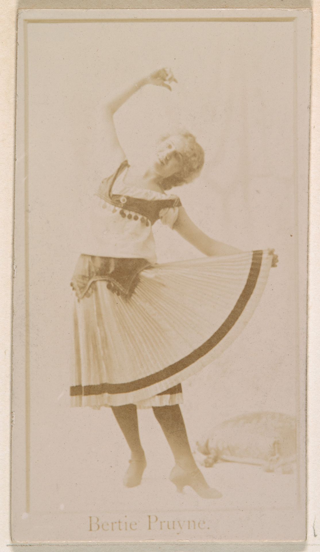 Bertie Pruyne, from the Actresses series (N245) issued by Kinney Brothers to promote Sweet Caporal Cigarettes by Kinney Brothers Tobacco Company