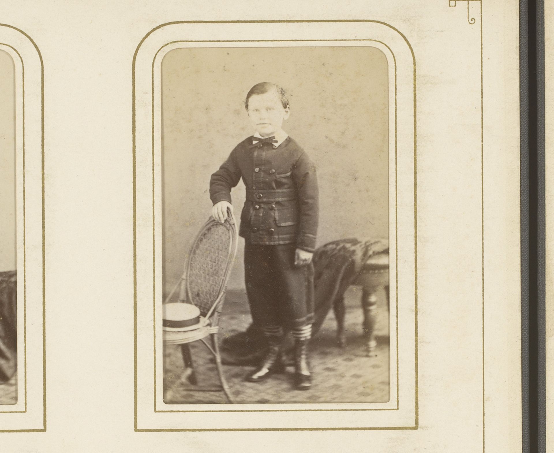 Portret van een jongen, staand bij een stoel met hoed by Prosper Bevierre