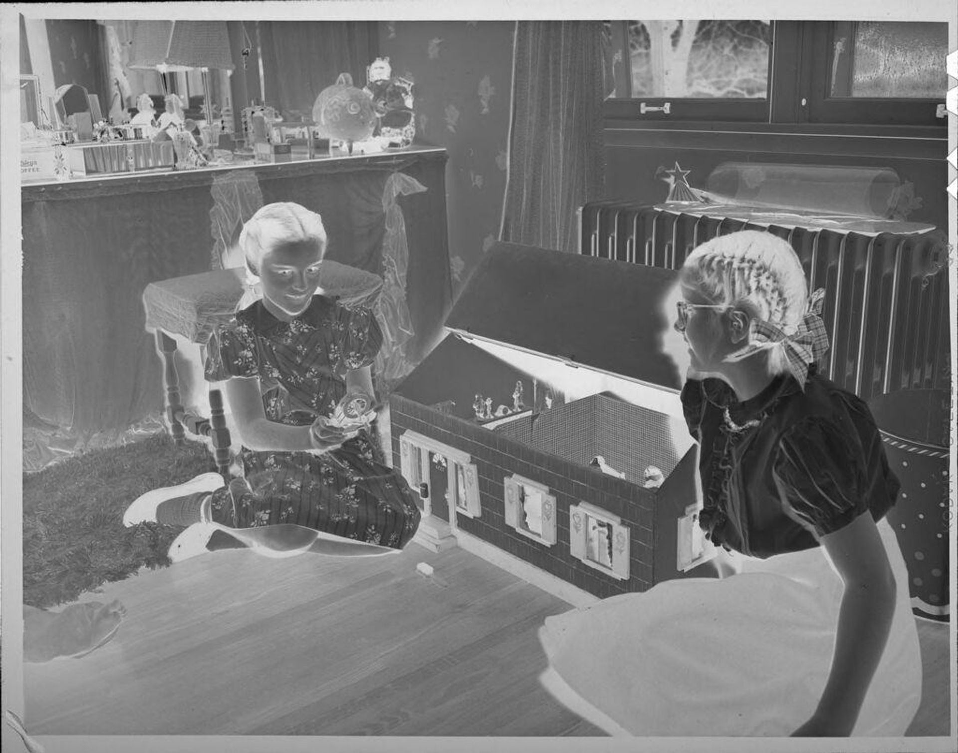 Untitled (two girls and dollhouse) by Lucian and Mary Brown