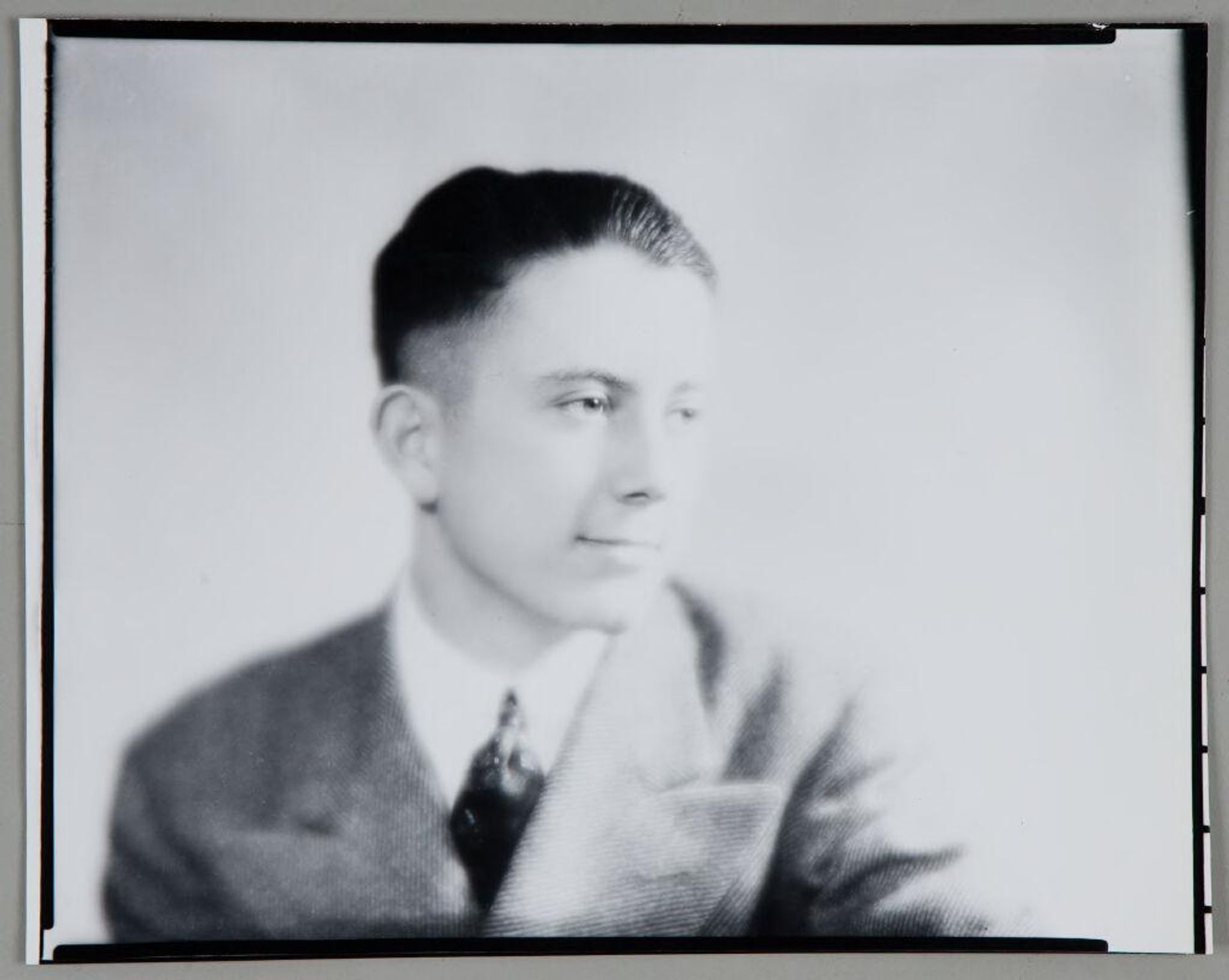 Untitled (portrait of young man in herringbone suit looking right) by Paul Gittings