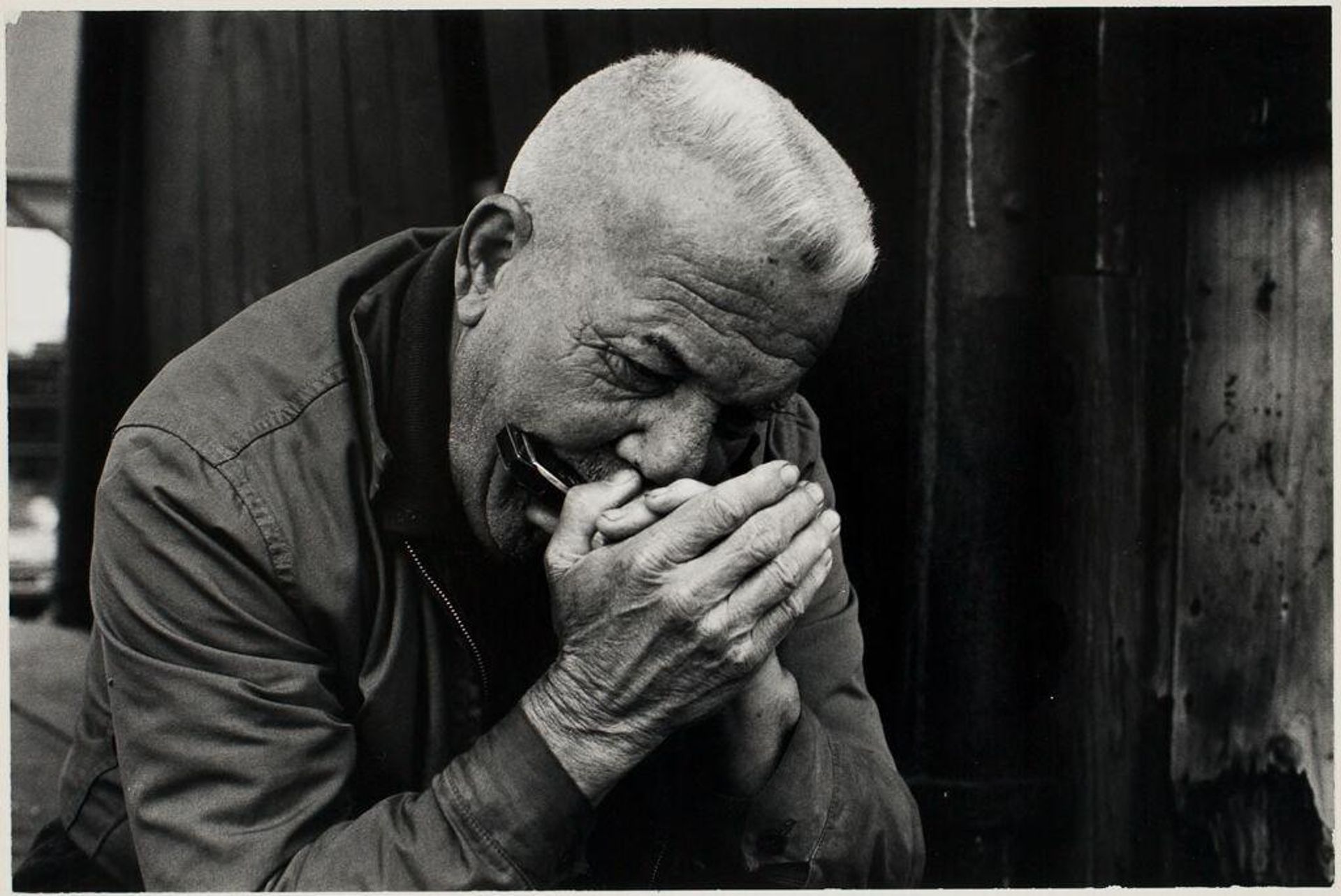 Untitled (man playing harmonica) by Michael Mathers