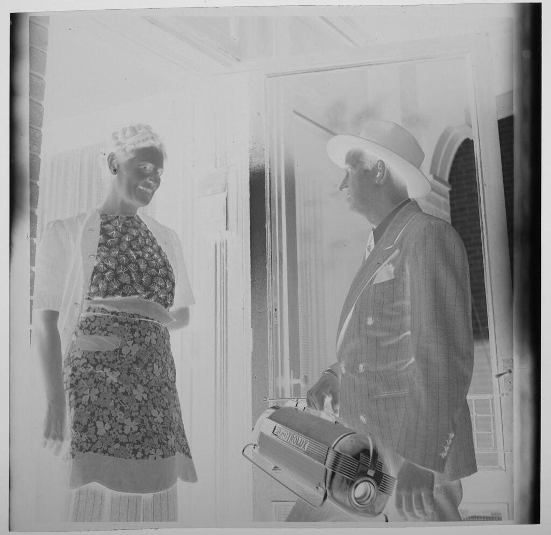 Untitled (door to door salesman with electrolux) by Jack Gould