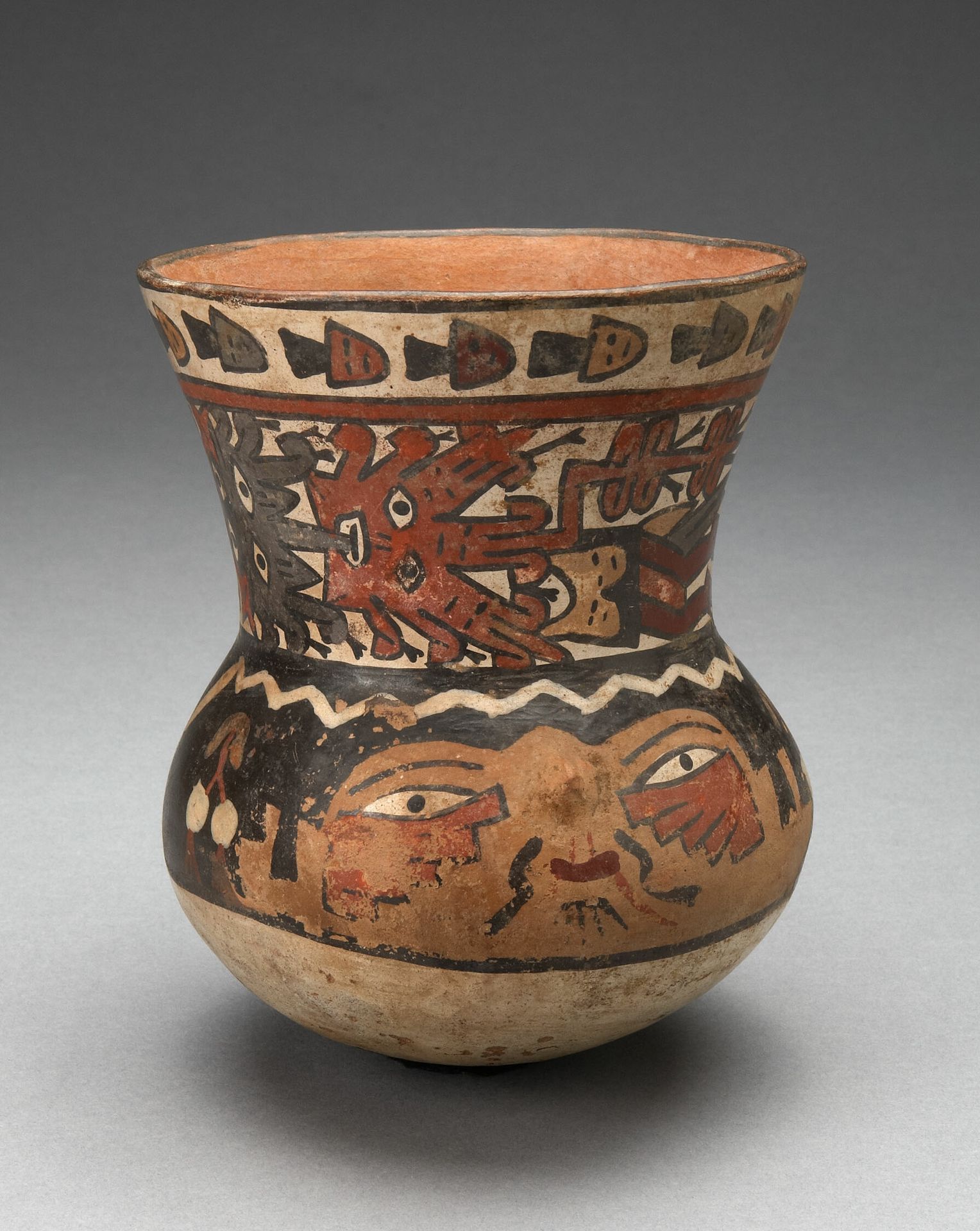 Beaker Depicting Human Head and Abstract Costumed Figures by Nazca