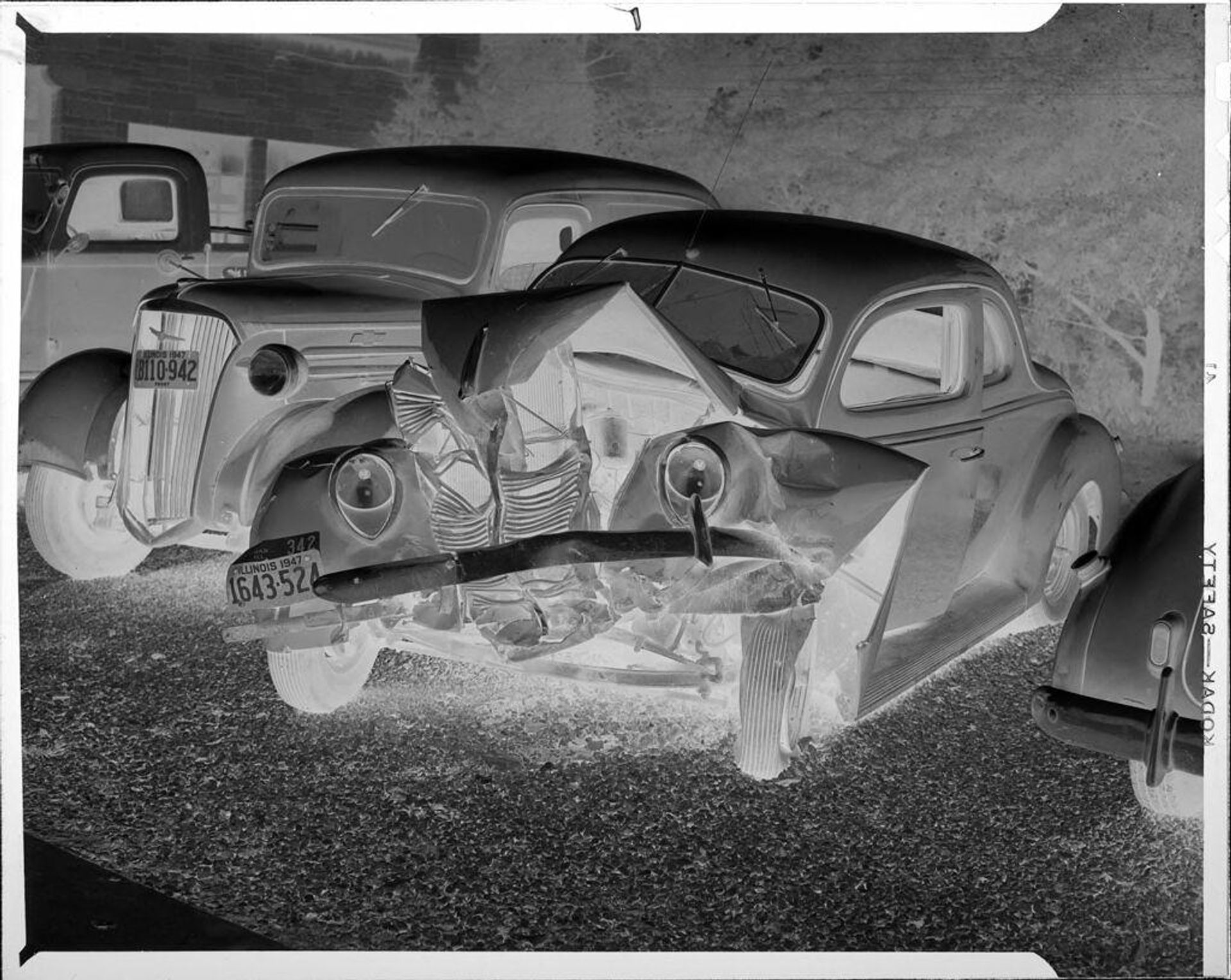 Untitled (several cars, one wrecked) by John Howell