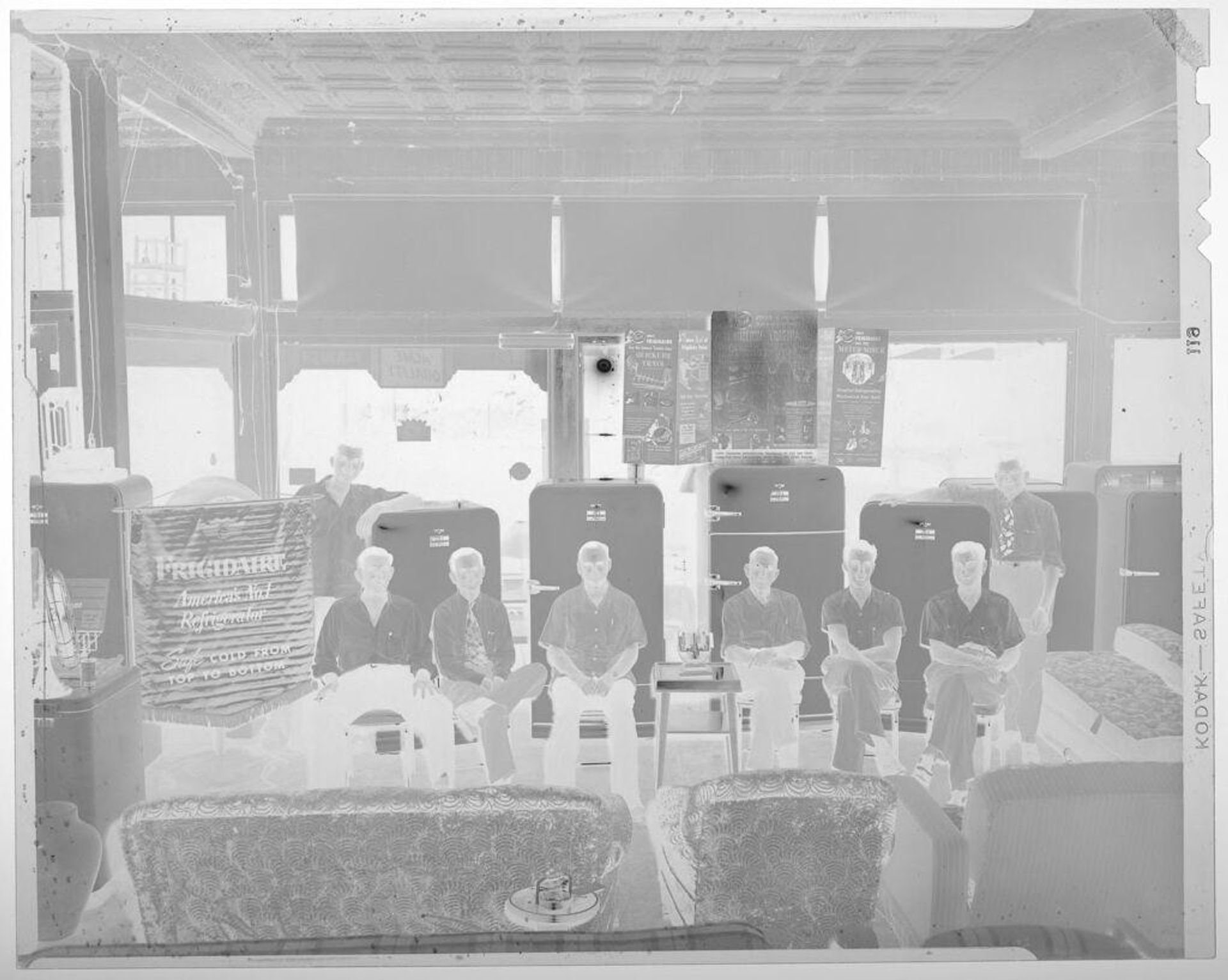 Untitled (group of men with Frigidaire refrigerators) by Harry Annas