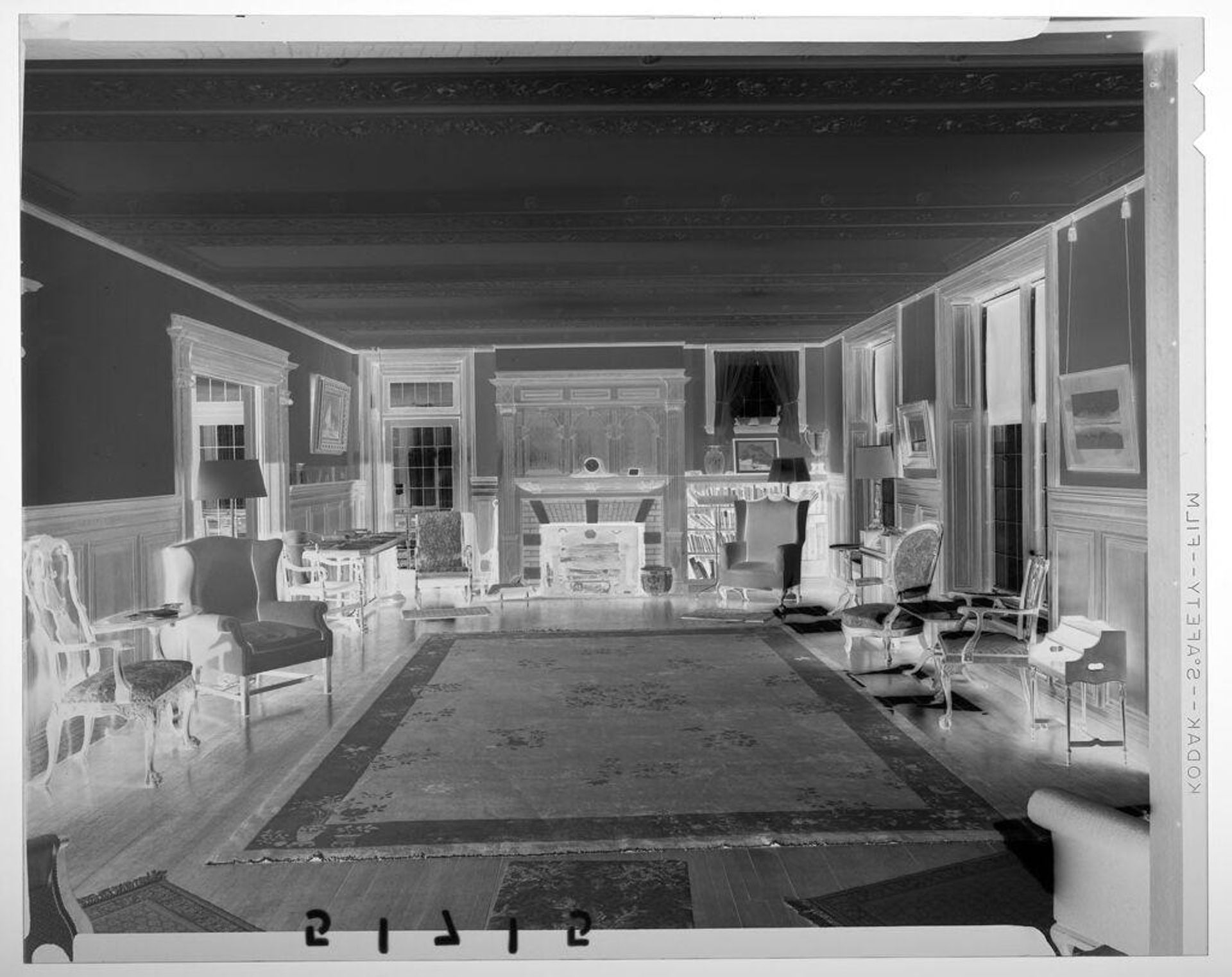 Untitled (interior view of large decorated drawing room with chairs, rug, and fireplace) by Martin Schweig