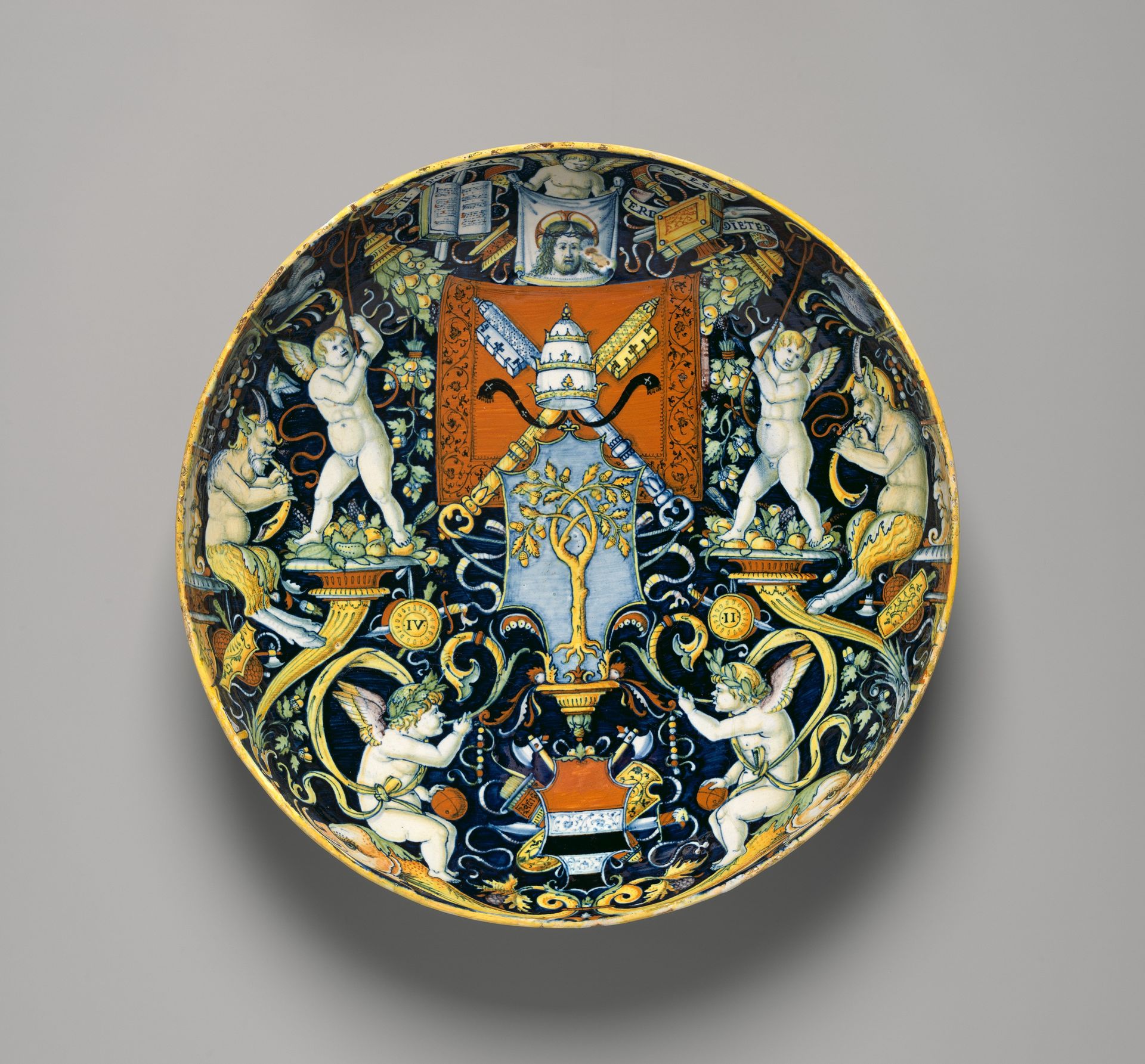 Bowl with the Arms of Pope Julius II and the Manzoli of Bologna surrounded by putti, cornucopiae, satyrs, dolphins, birds, etc. by workshop of Giovanni Maria Vasaro