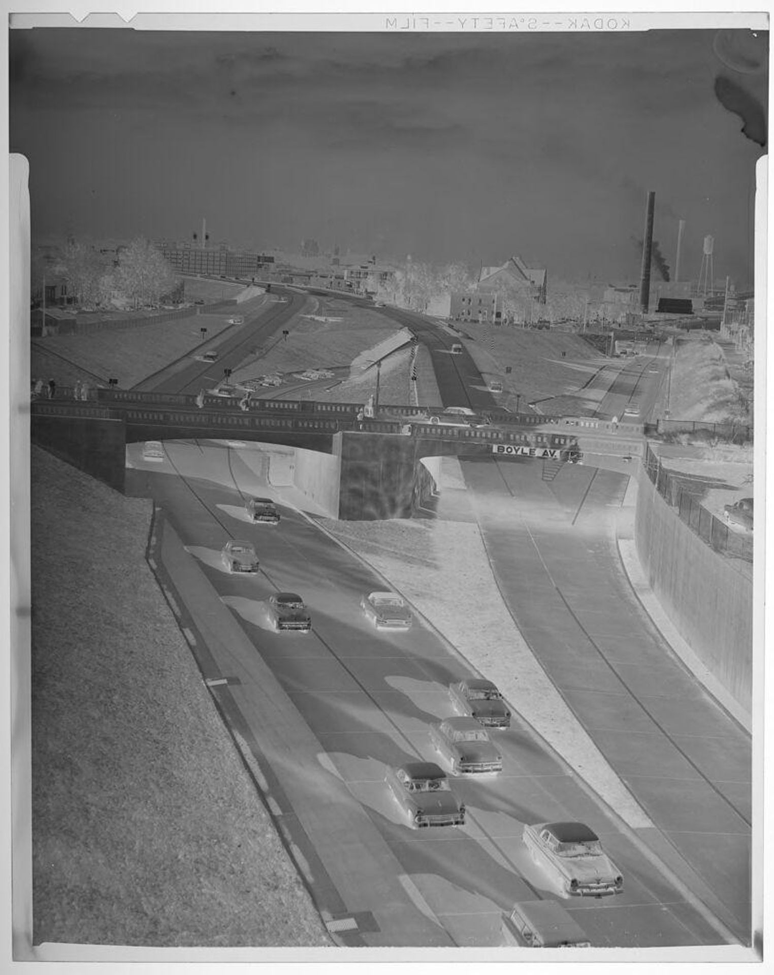 Untitled (cars driving on expressway, seen from above) by Jack Gould