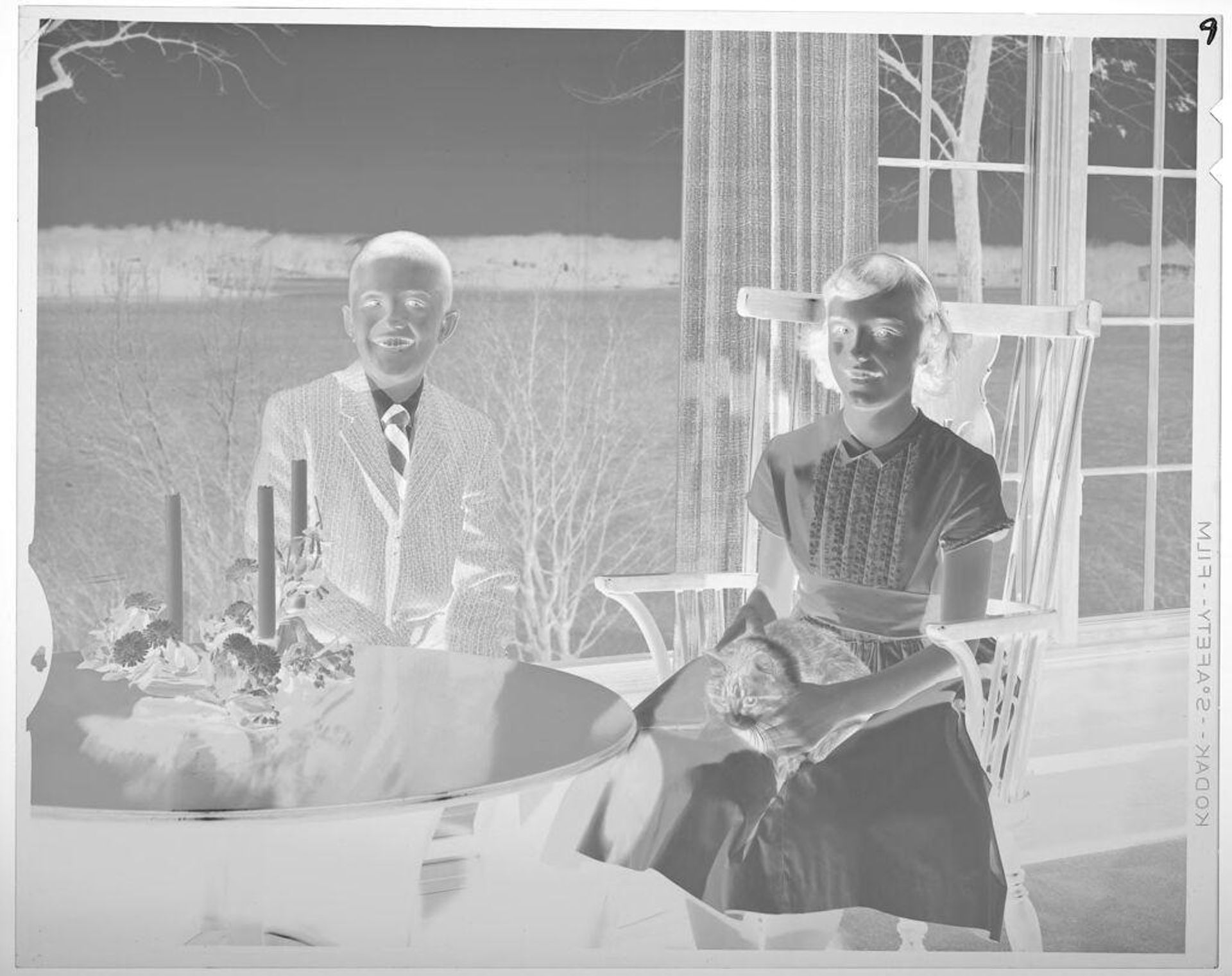 Untitled (boy and girl, seated, wearing formal attire) by Lucian and Mary Brown