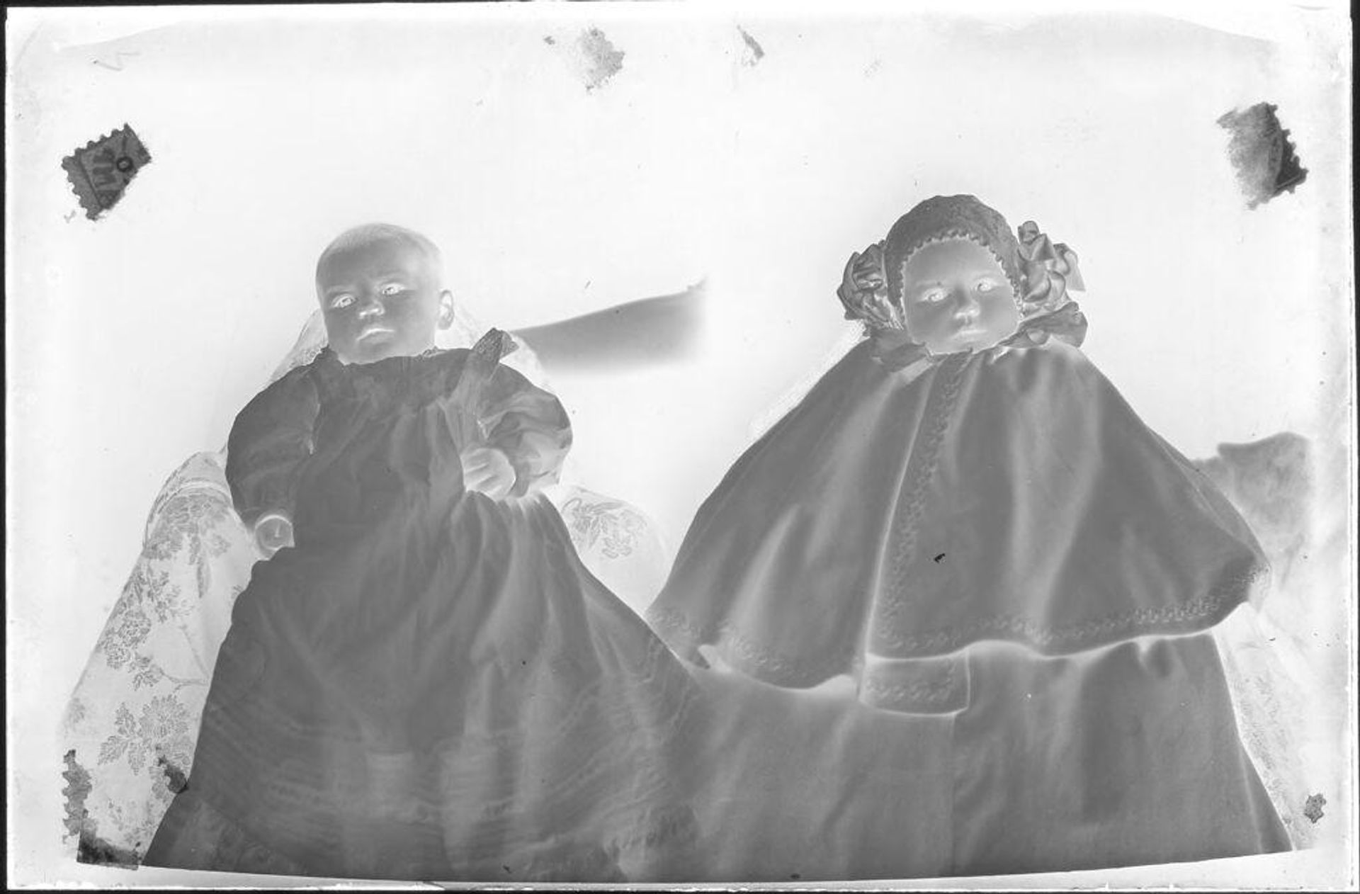Untitled (two portraits: one baby in bonnet, one without) by John Deusing