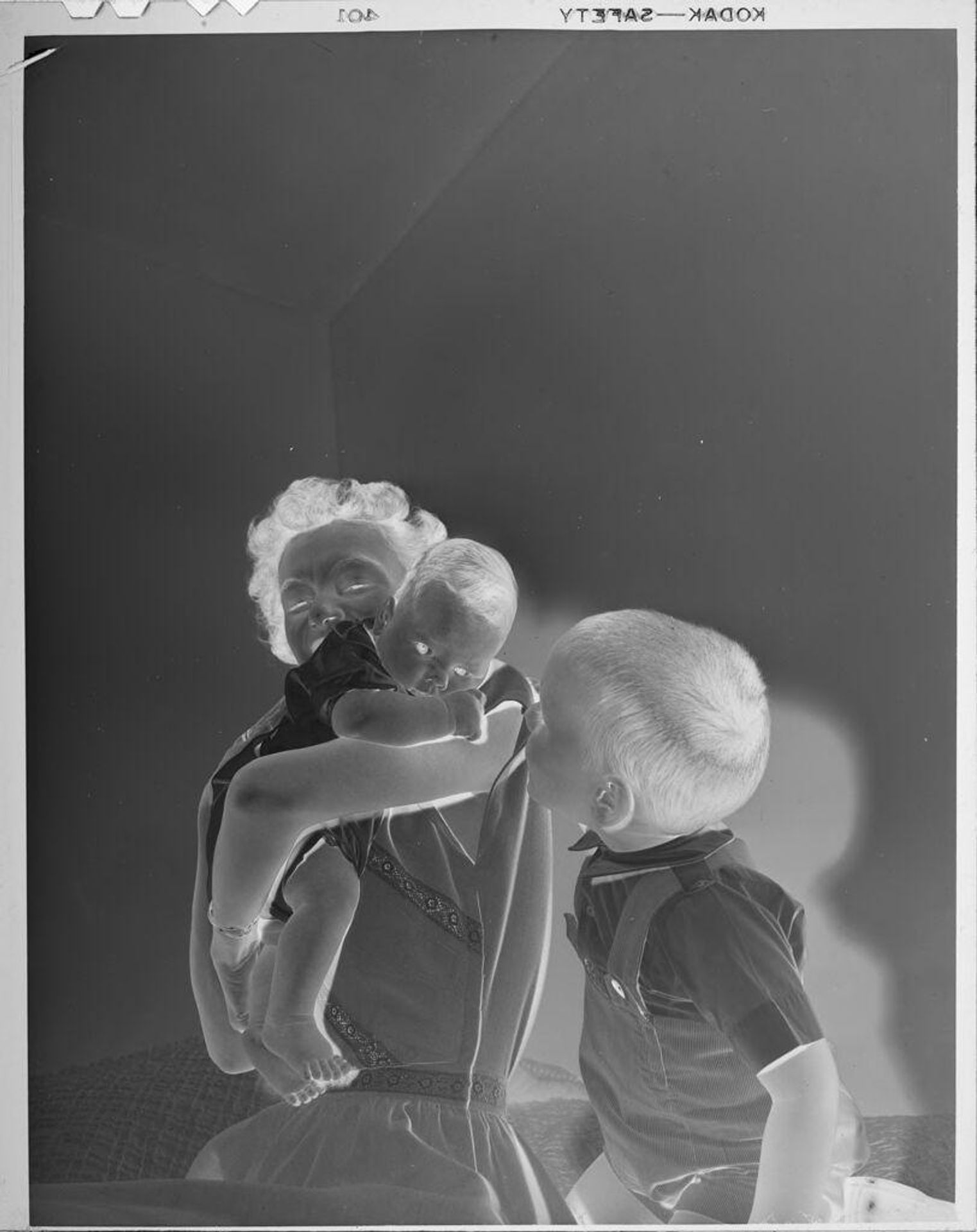 Untitled (woman sitting with two children) by Lucian and Mary Brown