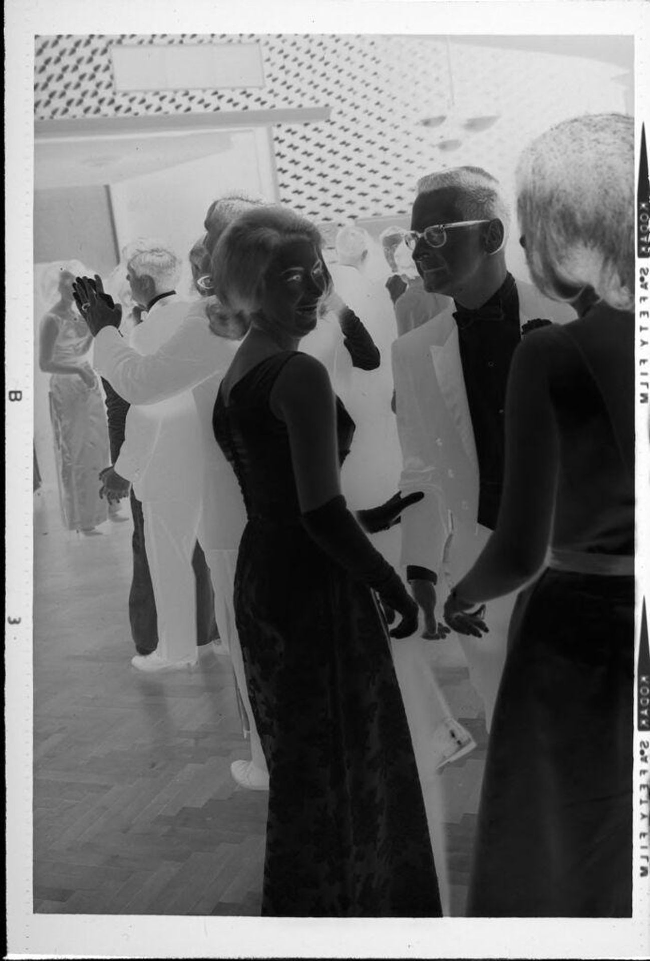 Untitled (men and women at fancy party) by Robert Burian