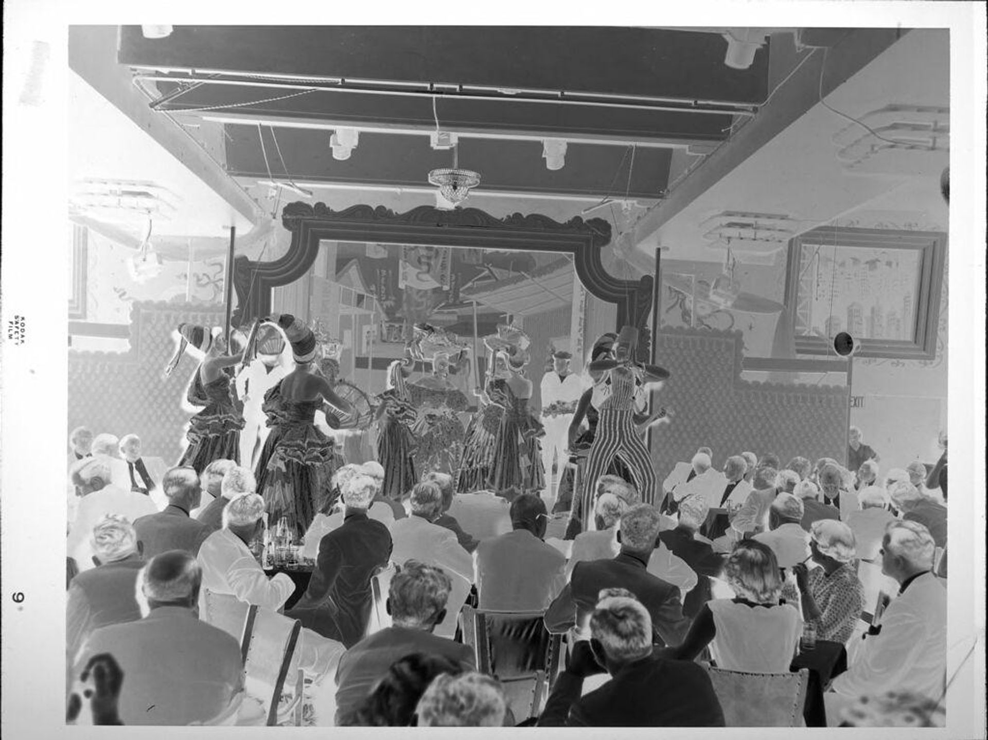 Untitled (performers on stage, crowd watching) by Peter James Studio