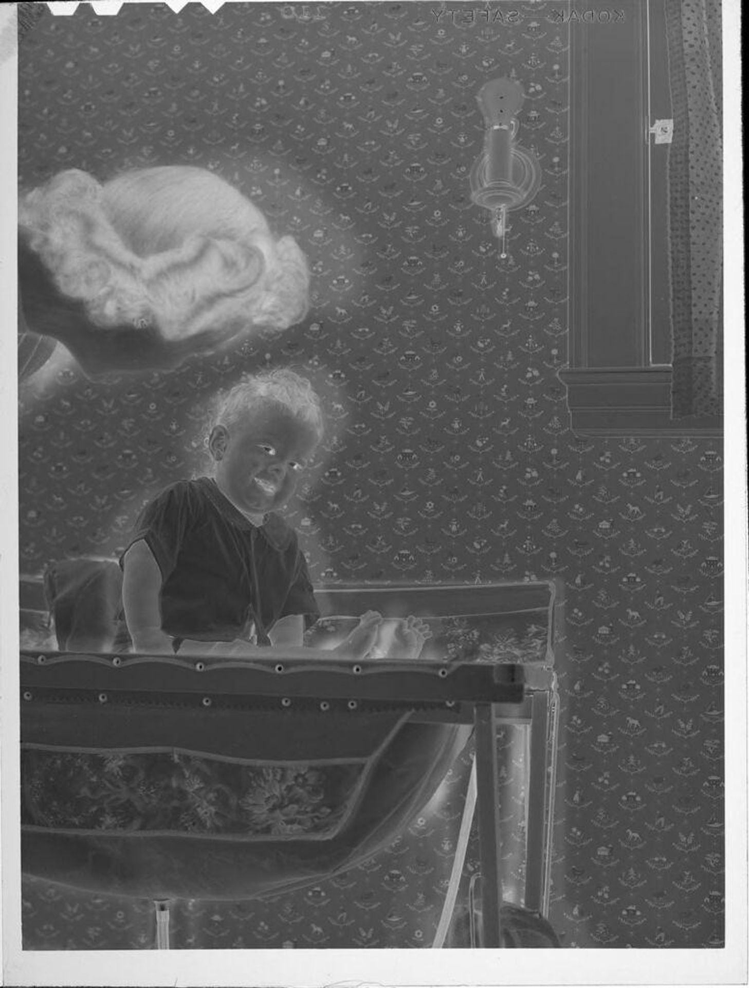 Untitled (baby on changing table) by Lucian and Mary Brown