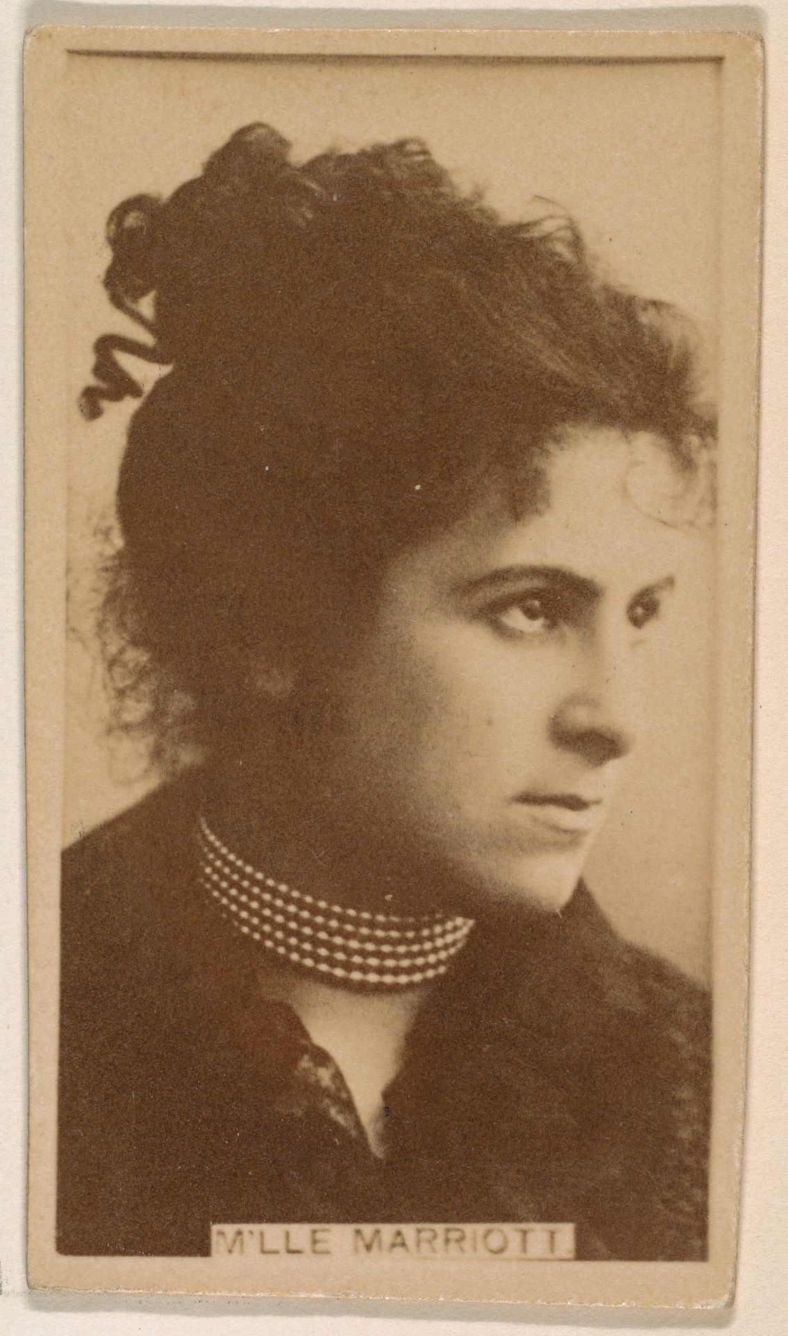 M'lle Marriott, from the Actresses series (N245) issued by Kinney Brothers to promote Sweet Caporal Cigarettes by Kinney Brothers Tobacco Company