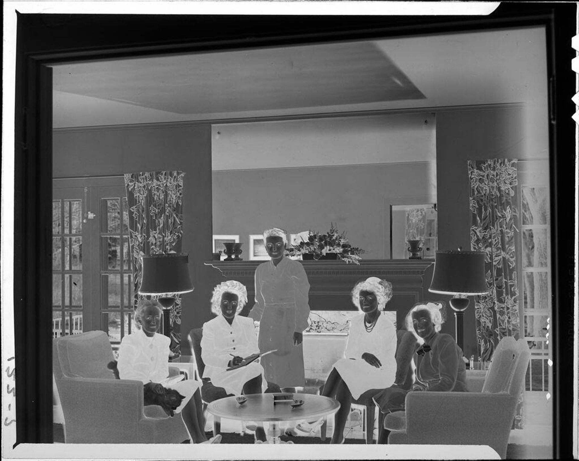 Untitled (five women sitting in living room) by John Howell