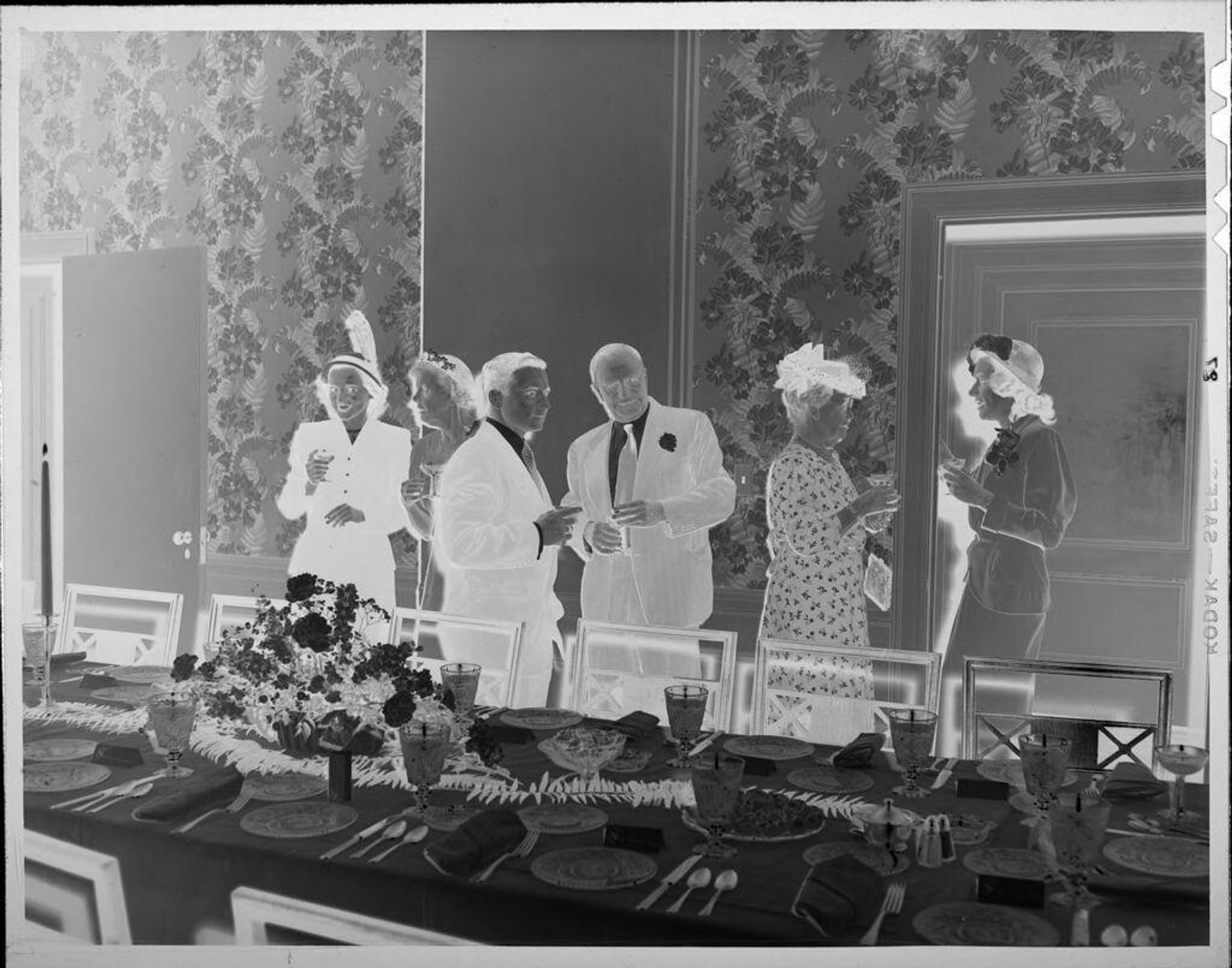 Untitled (men and women standing behind banquet table) by Lucian and Mary Brown