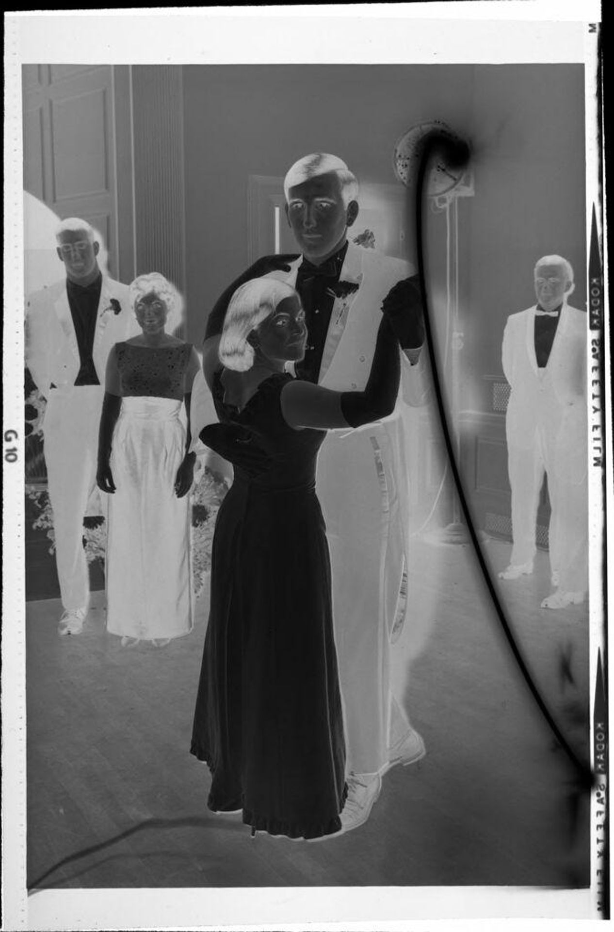 Untitled (young couple dancing, stream of light) by Robert Burian