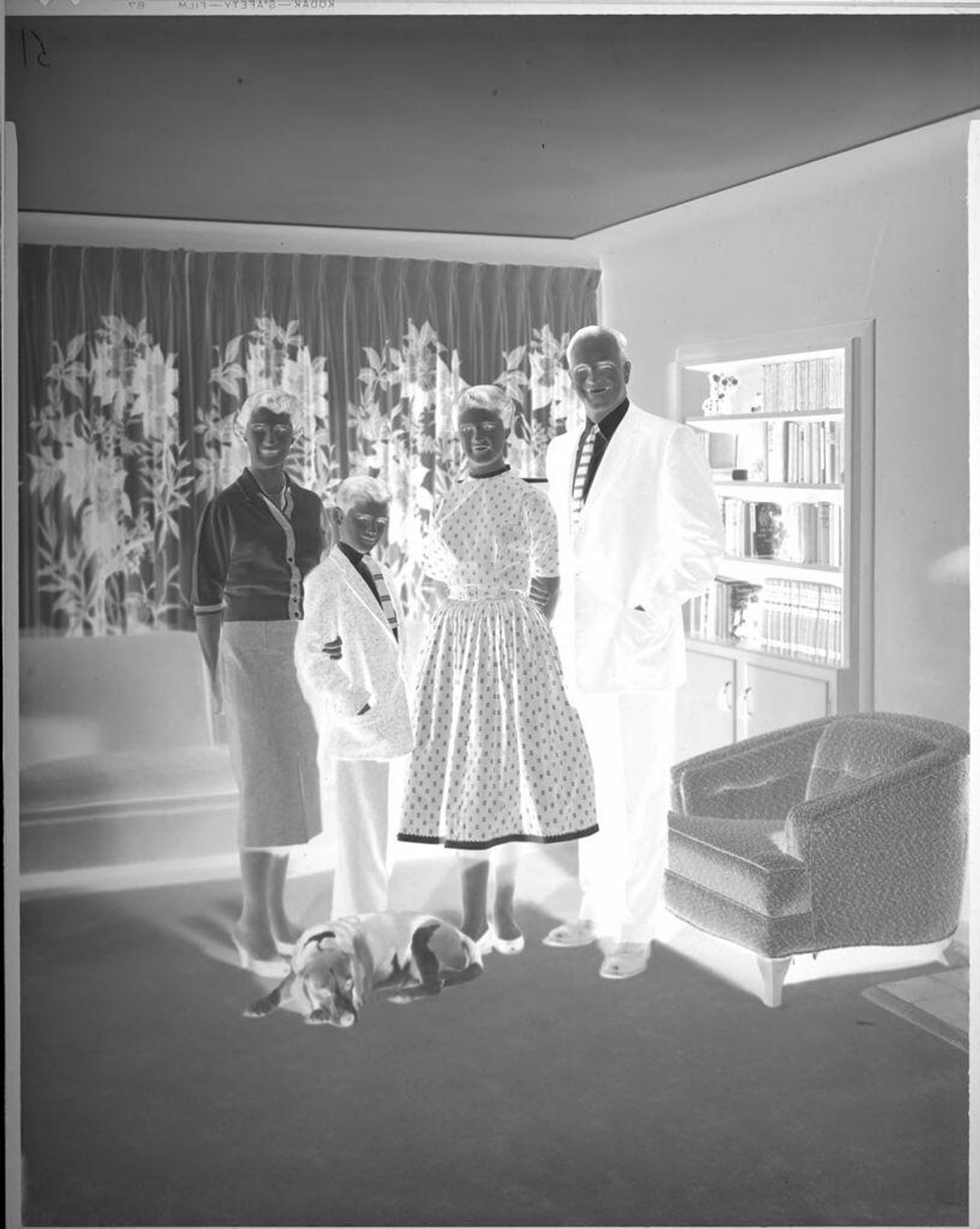 Untitled (family portrait in living room) by Lainson Studios