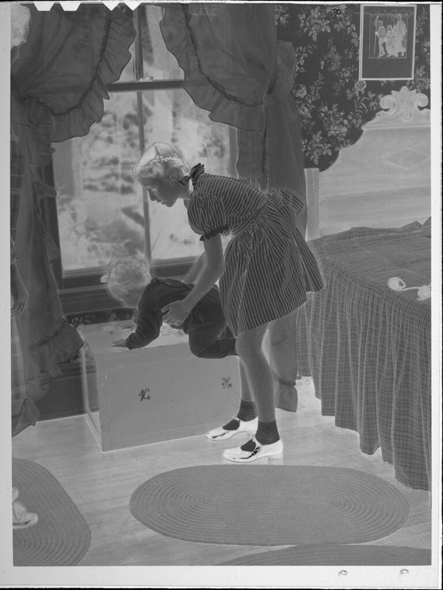 Untitled (girl with baby by window) by Lucian and Mary Brown
