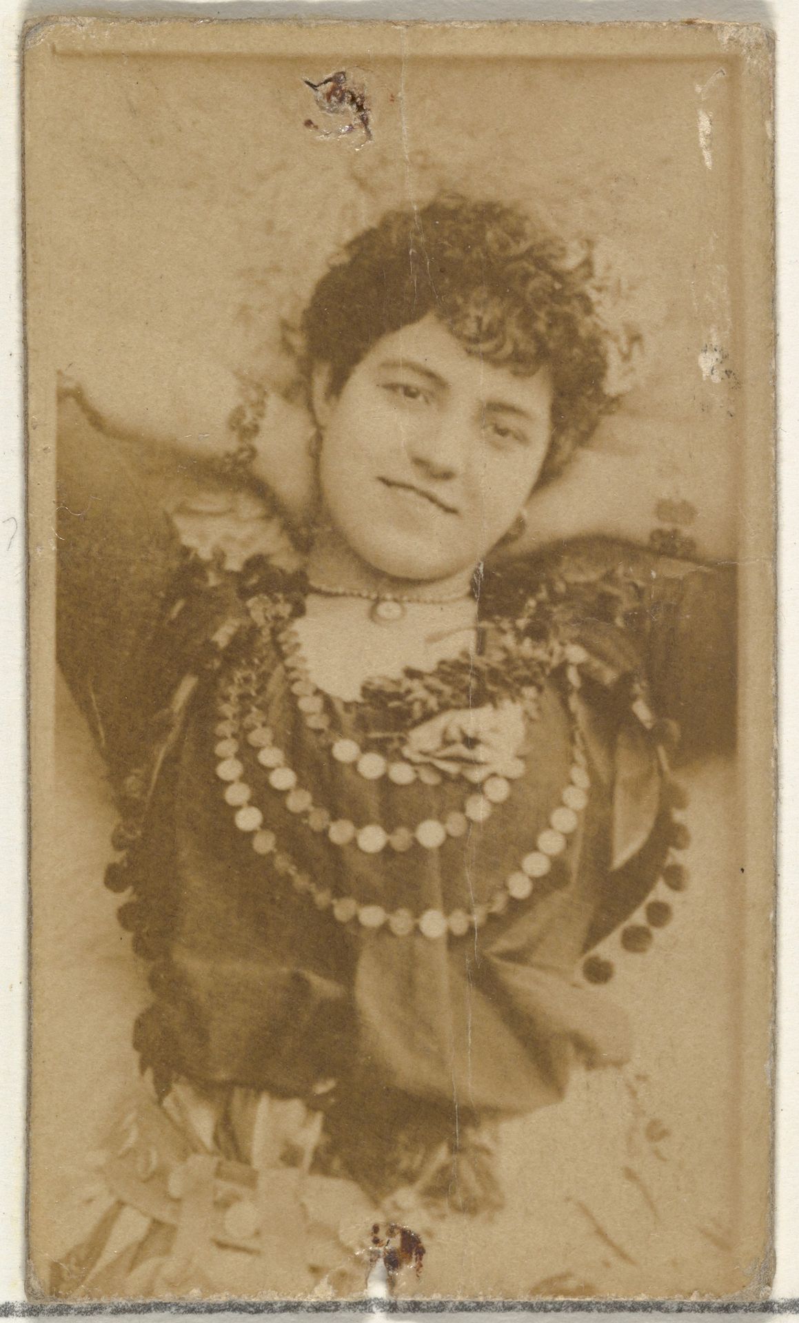 [Actress wearing choker necklace], from the Actors and Actresses series (N145-8) issued by Duke Sons & Co. to promote Duke Cigarettes by W. Duke, Sons & Co.
