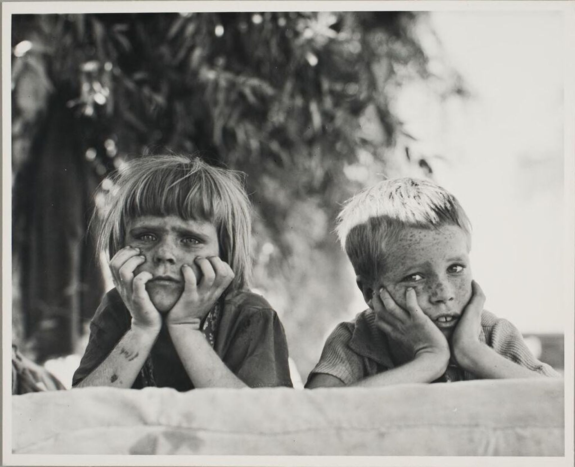 Children of Oklahoma drought refugee in migratory camp in California by Dorothea Lange