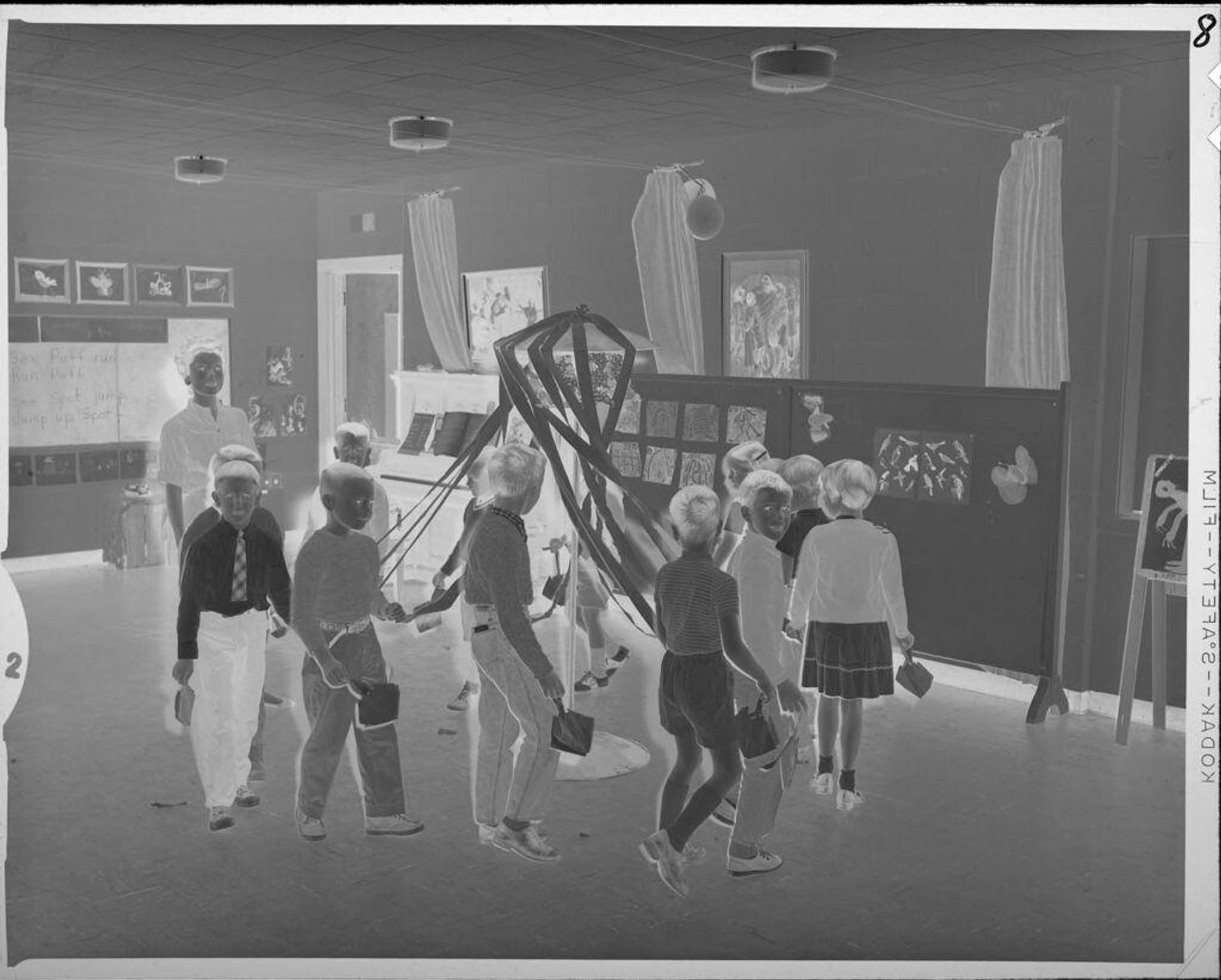 Untitled (children with Maypole in classroom) by Lucian and Mary Brown