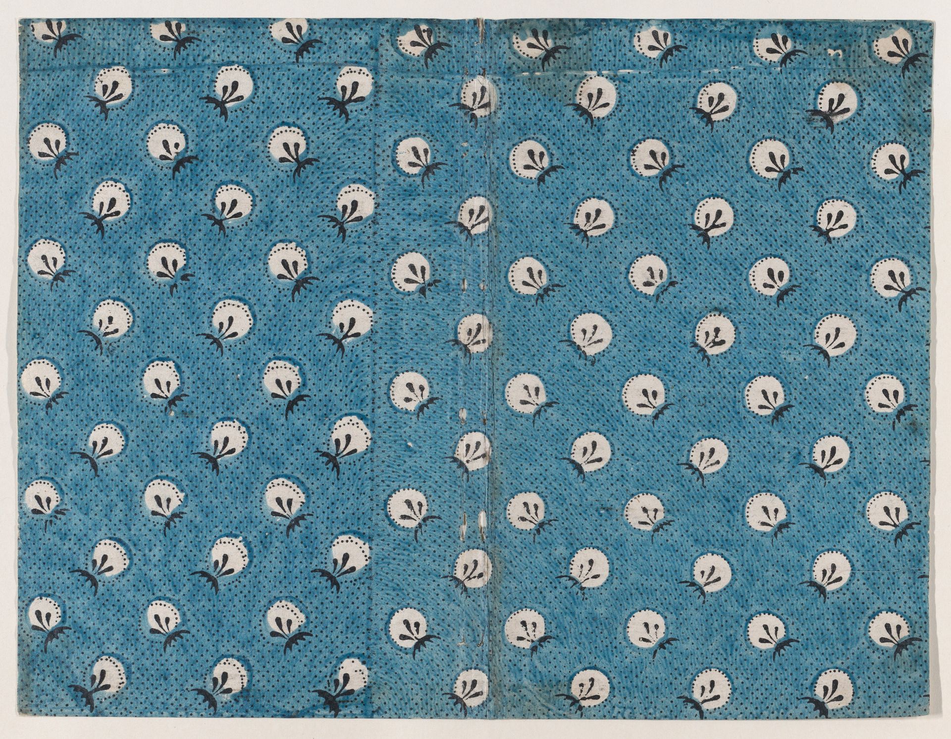 Book cover with overall pattern of dots and circles by Anonymous