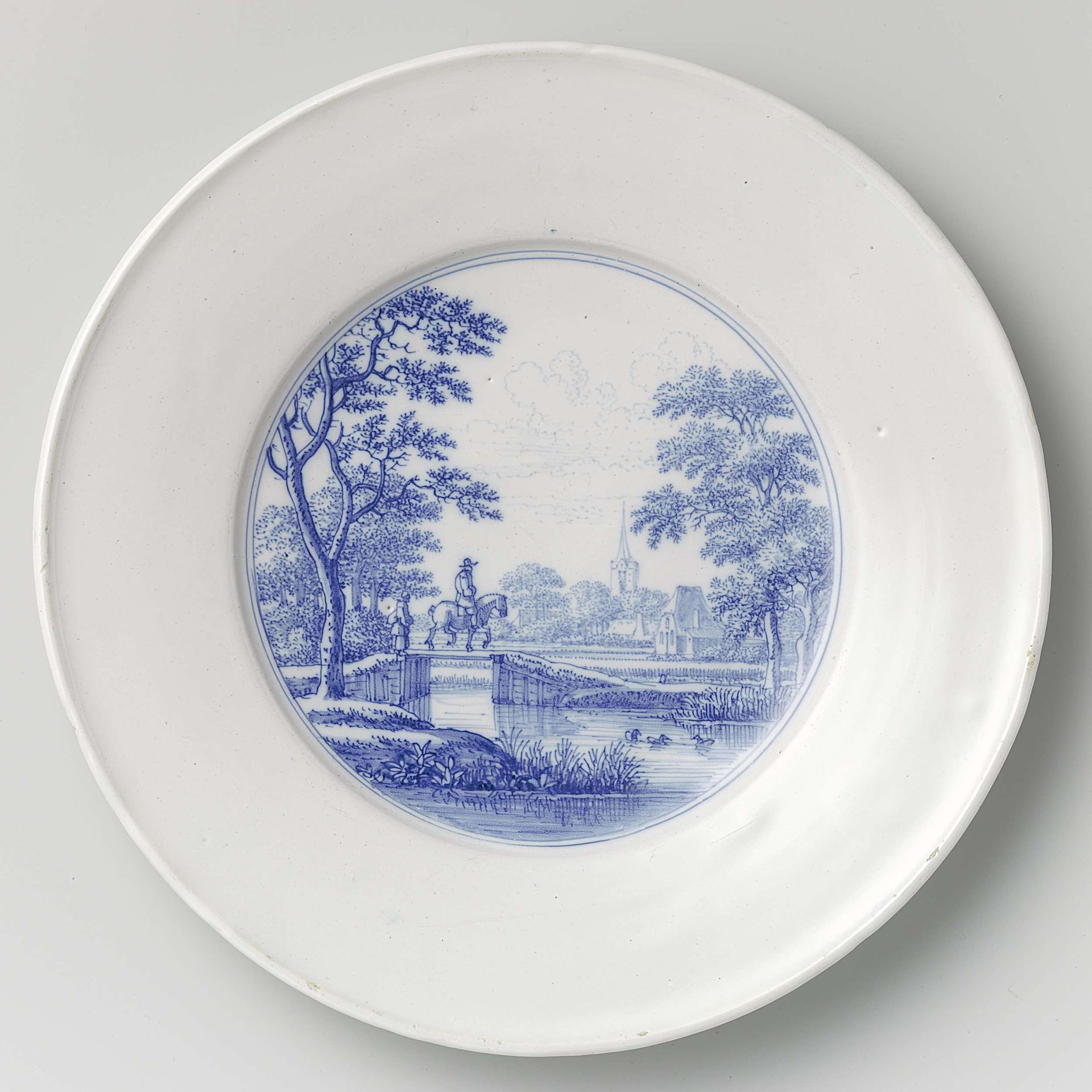 Bord met afbeelding van een ruiter in een landschap met brug, kerk en boerderij by Frederik van Frytom
