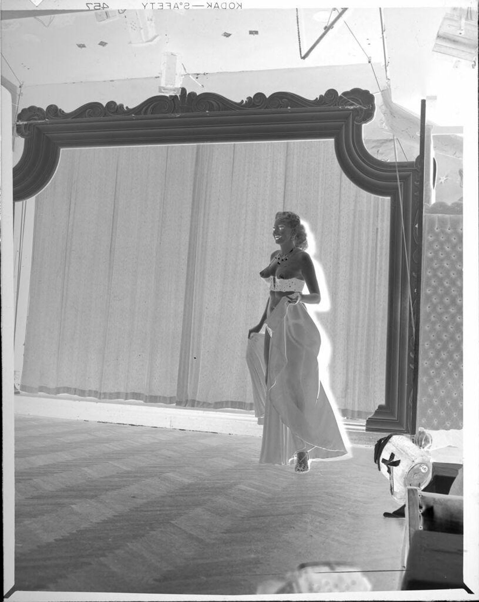 Untitled (semi-nude dancer on stage) by Peter James Studio