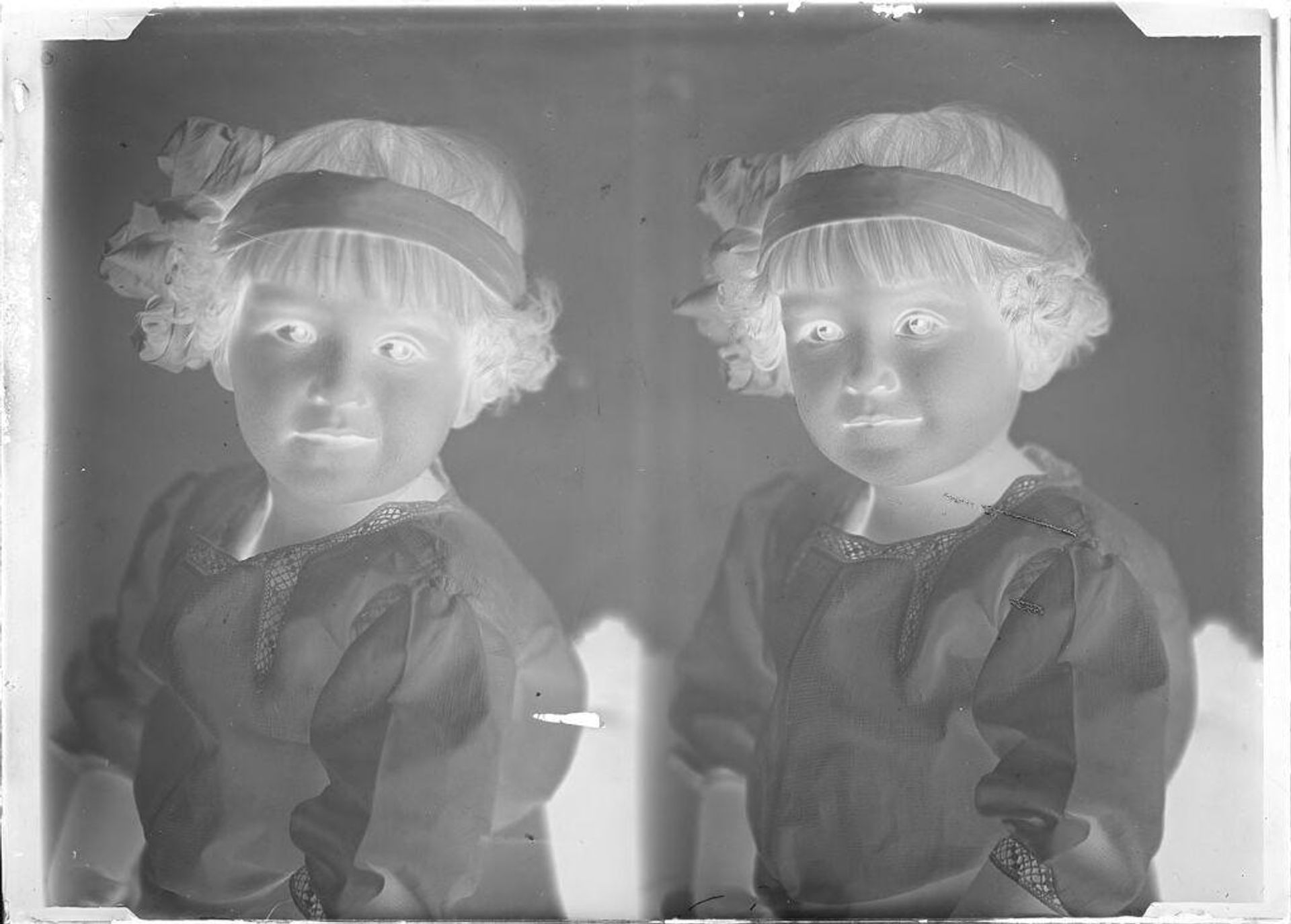 Untitled (two portraits of a little girl with headband) by John Deusing