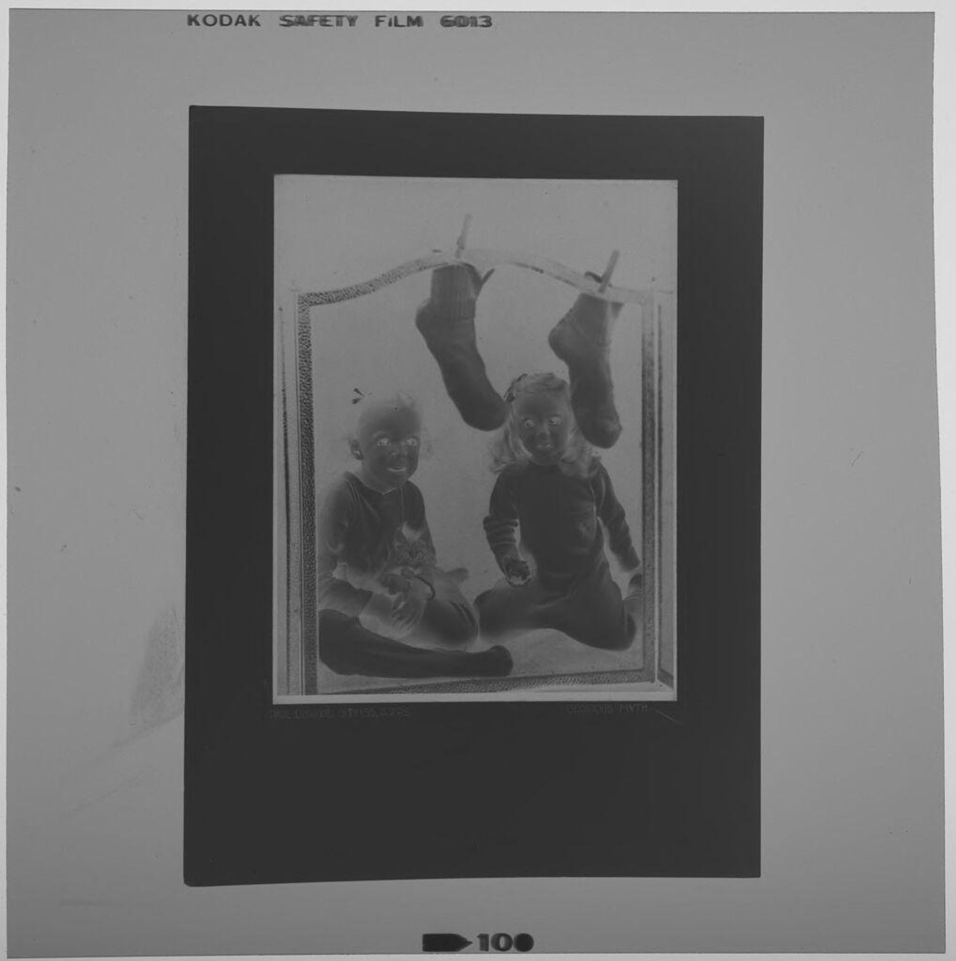 Untitled (rephotograph of picture of children seated by hearth with stockings hung for Santa Claus) by Paul Gittings