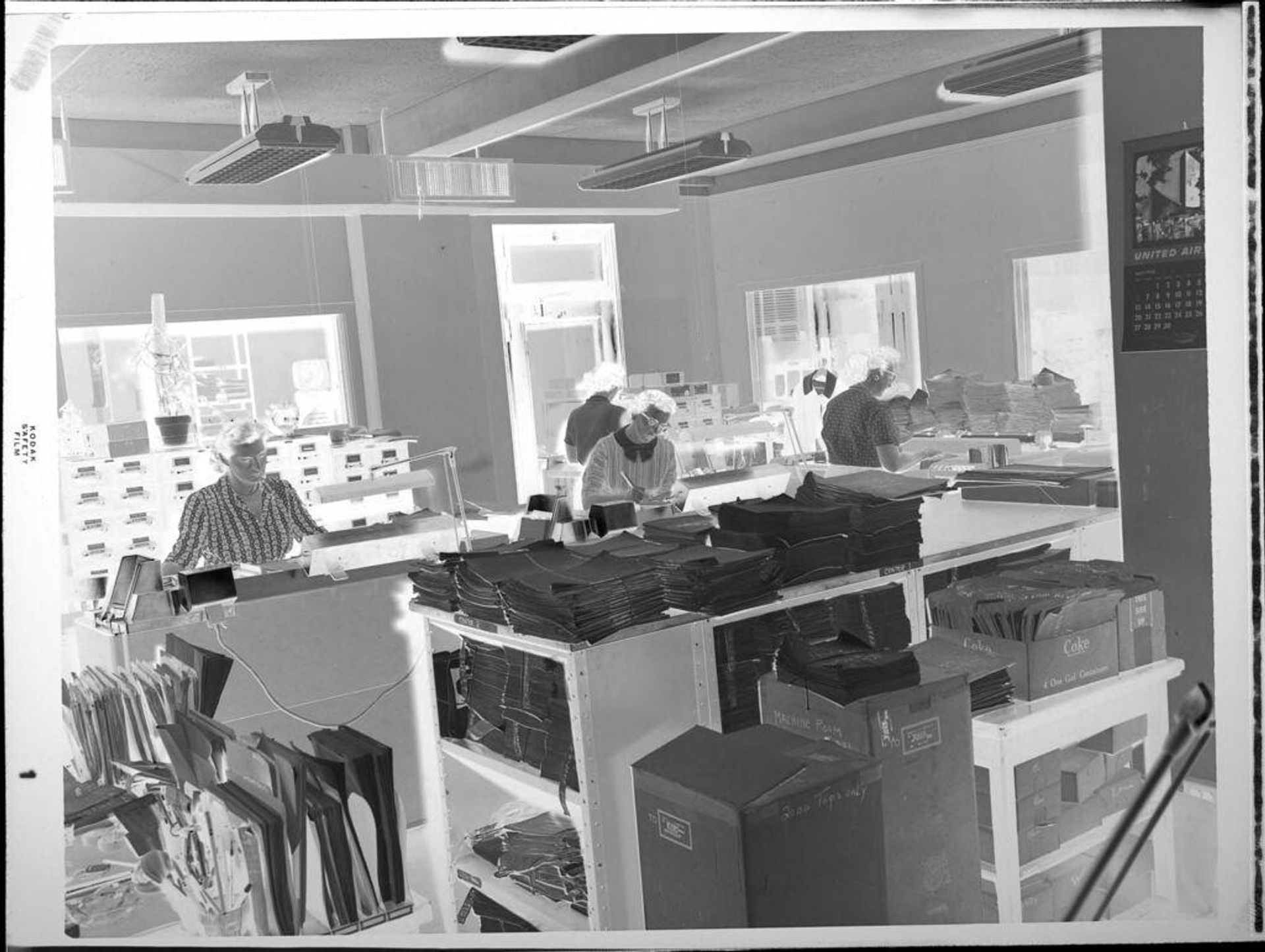 Untitled (women working in office) by Peter James Studio